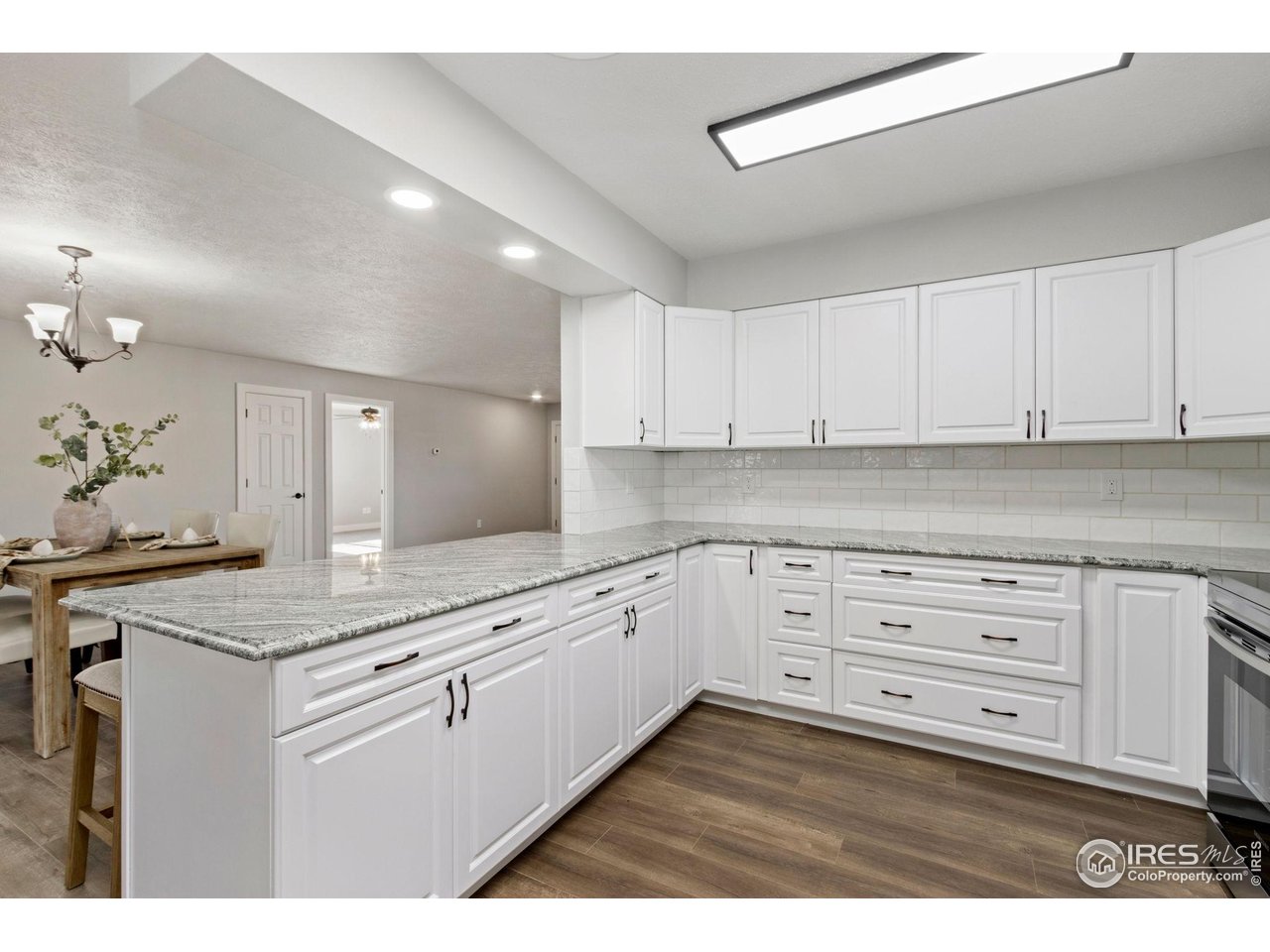 Take a walk on the West Side of Loveland with incredible views of the Rocky Mountains out your front window. Welcome to this beautifully remodeled ranch in the desirable Marianna Park subdivision. Bright, open, and thoughtfully updated, this home offers spacious main floor living with large, inviting bedrooms and a modern kitchen featuring stainless steel appliances. A sun-filled four-season room and generous laundry area add comfort and convenience to the layout. Outside, the fenced yard provides privacy and room to enjoy Colorado living. A rare highlight is the heated 4-car garage, complete with a half bath and abundant storage-perfect for projects, hobbies, or extra space. Well cared for and move-in ready, this standout property delivers exceptional comfort, style, and functionality. Don't miss your chance to see 4121 Silene Place-schedule your showing today!