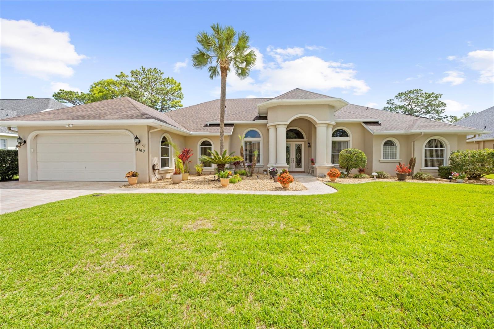 Welcome to 5160 Championship Cup Lane – absolutely gorgeous - a true masterpiece of exquisite design. Located in the prestigious guarded, gated Silverthorn golf community, this executive-style home is that perfect show piece you’ve been looking for. The seller has spared no expense in his meticulous renovations and it shows. From floor to ceiling, this home exudes fresh elegance. Let’s start outside and work our way through… Extensive landscaping gives this sprawling estate home amazing curb appeal. As you walk up to the double front doors and enter into the grand foyer, the “Wow” factor becomes real. Sparkling glazed tile floors throughout are met with soaring ceilings. You’ll get a view of the resort-style pool and oversized lanai from the moment you walk in. As you maneuver through the home, the extra-wide doorways, unique architectural features and new, cohesive fixtures really give that dramatic feel. The large living areas and open floorplan, coupled with the incredibly private enclosed pool area give you the perfect home for entertaining. Every living area and your primary suite give way to pool views. The gourmet kitchen – inclusive of a unique curved wet-bar, separate coffee bar, island and new appliances is a chef’s dream. The wall of windows in the family room overlooking the pool and golf course beyond make you feel like you’re in your own private oasis. The extra large primary suite boasts 2 separate sitting areas, a walk-in closet and a bathroom with separate soaking tub and stand-alone shower. The other 2 bedrooms are located on the other side of the home, with a remodeled Jack-and-Jill bath. The 4th bedroom is currently being utilized as a home-office.  The 4-car tandem garage is oversized and has it’s own A/C and heating unit – perfect for car enthusiasts! Quite possibly the gem of this property is the outdoor living space. The screened in newly-refinished pool with waterfall and tiled lanai, coupled with columns and gorgeous ceiling fans make you feel like you’re living at the spa. Privacy has been created with Florida greenery, but just beyond your pool cage is the 12th tee box of the Silverthorn golf course. Roof and hot water heaters are less than 2 years old. ACs are maintained with local company and regularly serviced. This home is sure to please the most discerning of buyers. With the extensive list of updates and high-end finishes, there is nothing left for the future owners to do except move in and start enjoying the Florida life. Schedule your private showing today – this is the one you do NOT want to miss and is priced to sell!