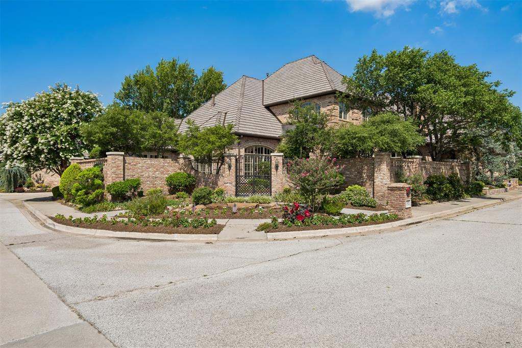 Beautiful custom-built home in desirable Brookhaven Square! Enter through beautiful wrought iron gates to an enchanting courtyard before stepping inside.  From the moment you walk in through the impressive leaded glass front doors, you will be amazed at the soaring ceilings and a grand curved staircase that is absolutely stunning! The formal living room has breathtaking views of the courtyard and has been recently updated with sand and finish hardwood flooring.  Your favorite spot may be the inviting kitchen that opens to a family room with a cozy fireplace.  The primary suite features a spa-like bath with a large walk-in shower, soaker tub, and an oversized walk-in closet. Upstairs, an impressive wrought iron staircase leads to two generously sized bedrooms, each with its own private bath, plus a loft/office.  Additional features include hardwood flooring, plantation shutters throughout, and a premium DaVinci roof. Recent updates include new hardwood flooring in the living room, new tankless water heater, new refrigerator/freezer compressor, new primary bath privacy doors, and new doors and windows in the primary bedroom and family room. A timeless home offering quality craftsmanship, thoughtful updates, and exceptional curb appeal in one of Norman's most sought-after neighborhoods.