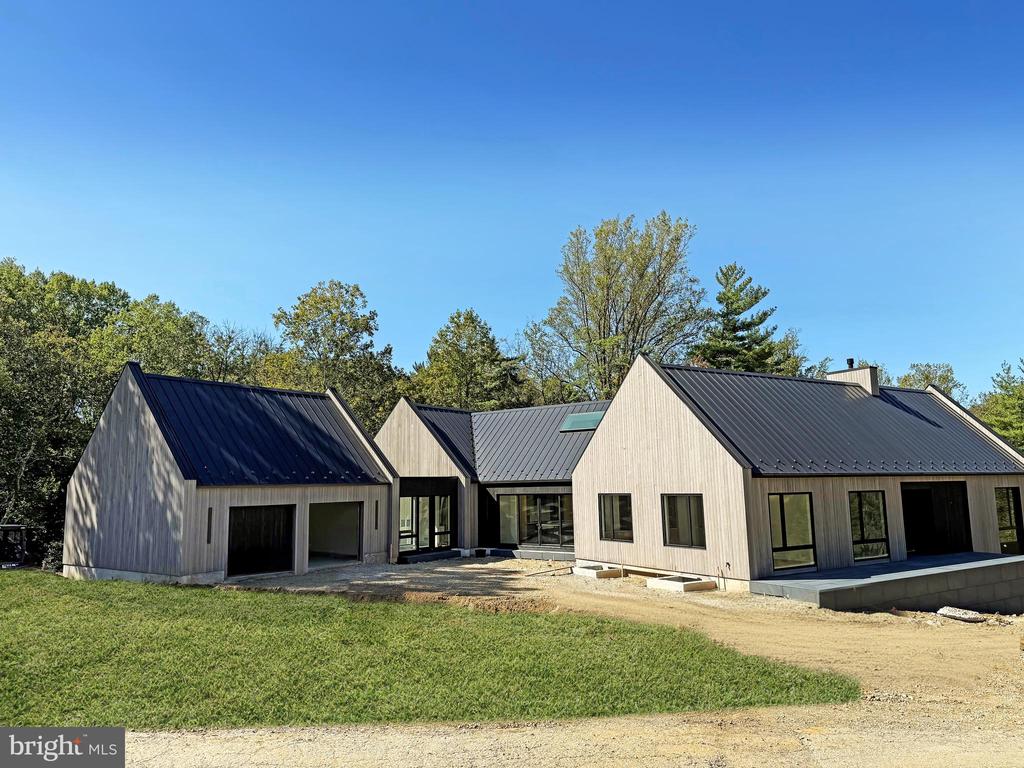 Exciting new Construction from Waverly Custom Homes.  Lot 3 at "Rockwoods" is located in a private setting backed by open space.  This modern floor plan offers 8800+ sq ft of living space with extravagant amenities.  2 bedrooms on main floor and 2/3 bedrooms on lower level.