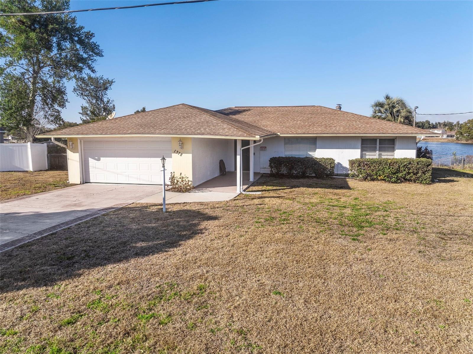 You need to see this home in person, to truly appreciate how tastefully and distinctly updated it is. Ceramic tile throughout, other than Florida room and bedrooms which are LVP. Numerous quality soft-close cabinets with quartz countertops and dovetail joints adorn the kitchen, dining room, and master bath, providing substantial storage. Windows are fitted with plantation shutters inside and hurricane shutters outside. The home is plumbed for natural gas, with capped access points for the kitchen stove, fireplace, clothes dryer and even one outside for a grill.  Several pool components have been replaced, including the pump, as well as the addition of a pool heater and saltwater system. The pool elevated against the lake, as well as the dock both allow for amazing and relaxing views.
