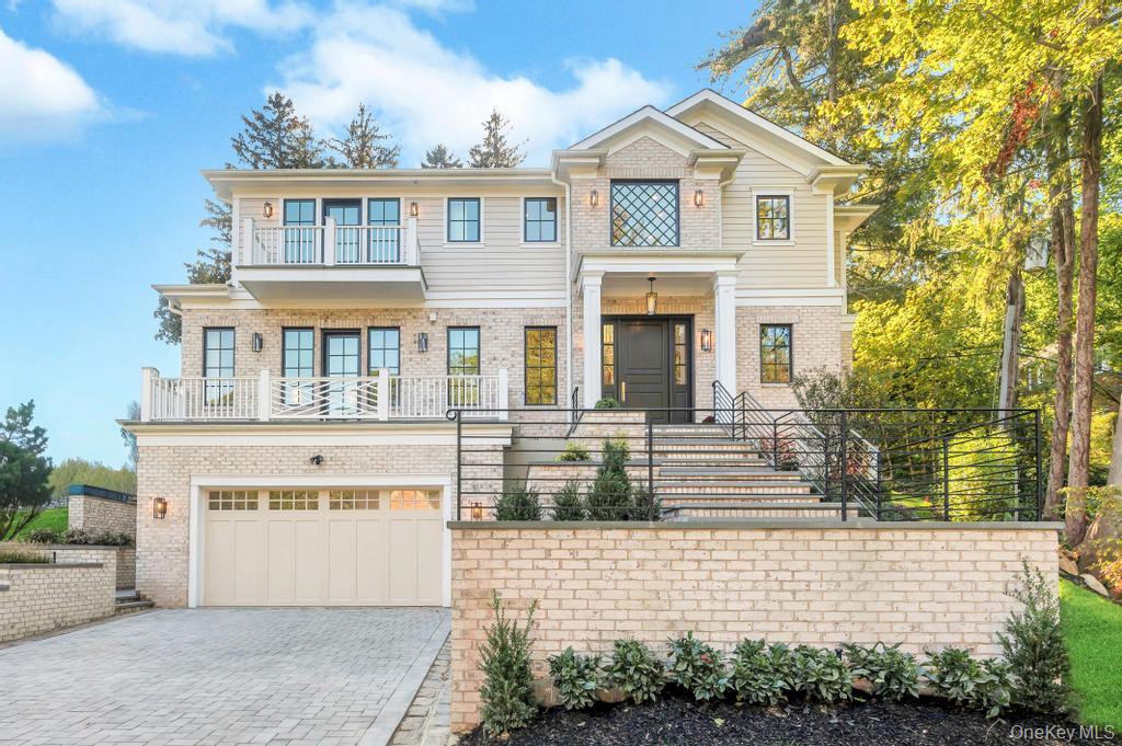 Stunning New Construction Residence In A Prime Location, Blending Timeless Elegance With Modern Comfort. This Exceptional Home, Located In One Of Manhasset's Most Desirable Neighborhoods, Offers Over 6,150 Square Feet Of Meticulously Designed Living Space, Perfectly Crafted For Today’s Lifestyle.
As You Step Inside, You’re Welcomed By Soaring Ceilings, Oversized Windows, And Custom Millwork Throughout. The Gourmet Chef’s Kitchen Is Equipped With Top-Of-The-Line Appliances, Custom Cabinetry, A Large Center Island, And Opens Into The Spacious Den Featuring A Gas Fireplace And Easy Access To The Private Backyard — Ideal For Indoor-Outdoor Entertaining.  The Main Level Also Offers A Formal Dining Room, Butler's Pantry, A Living Room/Guest Suite With En-Suite Bath, Home Office and Powder Room.  Upstairs, The Luxurious Primary Suite Includes Two Walk-In Closets And A Spa-Inspired Bath With A Soaking Tub, Oversized Shower and Radiant Heated Floors. Three Additional Bedrooms, Each With En-Suite Bathrooms, and Laundry Room Complete This Level.  The Fully Finished Walk-Out Basement Boasts High Ceilings, An Additional Bedroom and Full Bath, A Custom Bar, A Second Laundry Room, Mudroom And Ample Space For A Recreation Area, Gym, Or Media Room.  Additional Features Include Radiant Heat Throughout, An Elevator Servicing All Floors, A Whole-House Generator, And A Two-Car Garage. Ideally Located in Close Proximity to the Strathmore Vanderbilt Country Club and Minutes from the Manhasset LIRR, Town, Americana Shopping Center and Dining ,This Exceptional Strathmore Home Is A Must-See!