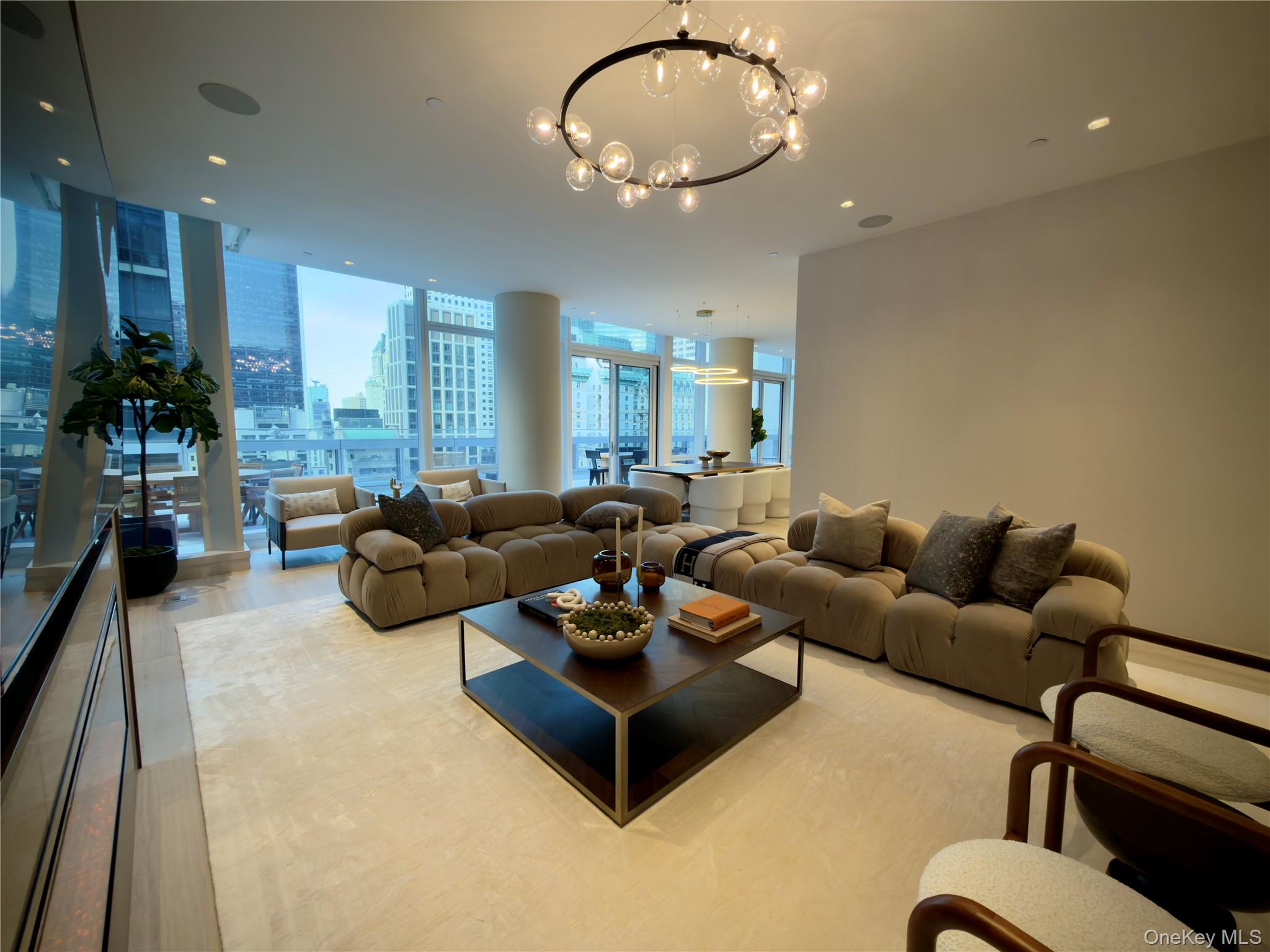 Located within the prestigious Baccarat Residences, this exceptional home spans approximately 4,600 square feet, offering 5 bedrooms and 7 bathrooms. The residence features two expansive primary suites with walk-in closets, European oak flooring throughout, and a refined living room with fireplace.The designer kitchen is outfitted with custom wood cabinetry, stone countertops, and a full suite of high-end appliances, seamlessly blending function and sophistication.A true standout is the private 3,500 square foot stone terrace, thoughtfully landscaped and designed for entertaining. Complete with outdoor lighting, irrigation, and multiple seating and dining areas, it offers a rare extension of indoor living.Residents of Baccarat enjoy access to a full suite of five-star hotel amenities, including a signature restaurant, in-residence dining, bar and lounge spaces, private meeting rooms, fitness center, heated pool with cabanas, La Mer Spa, and 24-hour concierge service.