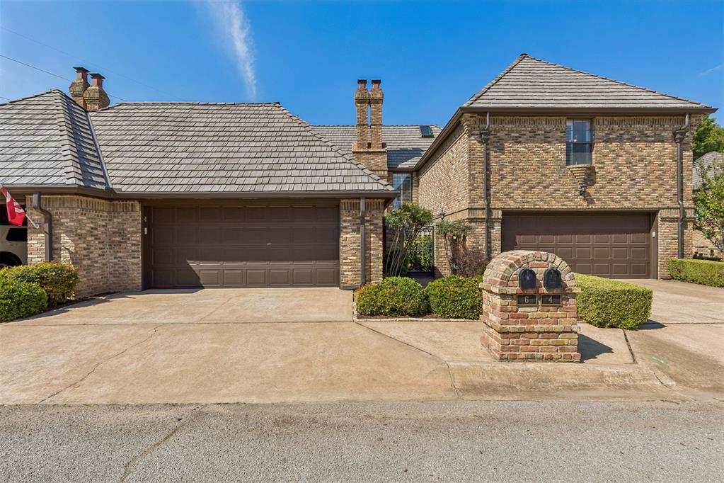 Be one of the fortunate few to call coveted Brookhaven Square home! This beautiful property offers an exceptional blend of elegance, comfort, and carefree living, with pride of ownership evident from the moment you arrive. A charming iron-gated entry welcomes you into beautifully maintained grounds with pristine landscaping & an incredibly low-maintenance lifestyle. Step inside & you’ll immediately appreciate the thoughtful design & inviting atmosphere. The spacious living area features soaring ceilings and a stunning floor-to-ceiling brick fireplace that creates the perfect setting for cozy evenings, relaxing with a good book, or gathering with friends & family. Beautiful plantation shutters.  A stylish wet/coffee bar adds an extra touch of luxury and convenience to this wonderful living space. The kitchen offers stainless steel appliances, generous cabinetry, & excellent functionality, with the refrigerator included. Two distinct dining areas provide plenty of options for entertaining from casual mornings in the breakfast nook to memorable dinners around a larger table in the more formal dining area. A bedroom & utility room are conveniently located on the first floor, offering flexibility for guests, family members, or a home office. Upstairs, a fabulous loft provides versatile space for a second living area, media room, playroom, or home office. The spacious primary suite is a true retreat, featuring a private balcony that is perfect for morning coffee, unwinding at the end of the day, or simply enjoying the beautiful Oklahoma sunsets. Step outside to the back patio & you'll find just enough yard space for pets or relaxing outdoors without the burden of extensive maintenance. Additional features include alarm system and a stand-up storm shelter in the garage, both of which remain with the property. Beautifully cared for & thoughtfully designed, this Brookhaven Square gem offers the lifestyle you've been waiting for beautiful, comfortable, low-maintenance living.