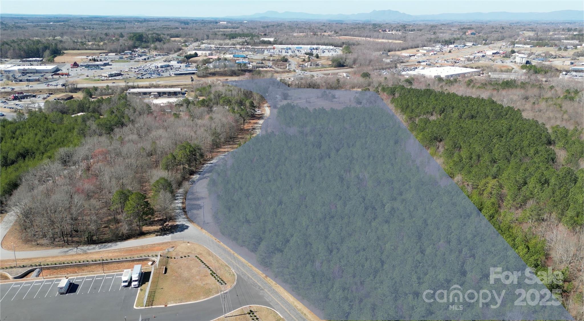 Prime 20.86-Acre Development Opportunity in Forest City, NCThis exceptional 20.86-acre property is strategically located in the heart of the retail corridor of Forest City, NC, offering unmatched development potential. Just a few miles from the Hwy 74 exit, the site is surrounded by high-traffic retailers such as Lowe’s, Walmart, and Belk, making it an ideal location for new commercial or residential projects.The property benefits from high visibility and easy access, thanks to its proximity to popular brands like Chipotle and Starbucks, which have recently opened in the area. This increasing consumer activity in the region signals strong future growth potential.With its flat topography and all utilities already on-site, the property is ready for development. Whether you’re looking to create residential spaces like apartments, single-family homes, or townhomes, or possibly a big-box store or shopping center, this site can easily accommodate a wide variety of projects.
