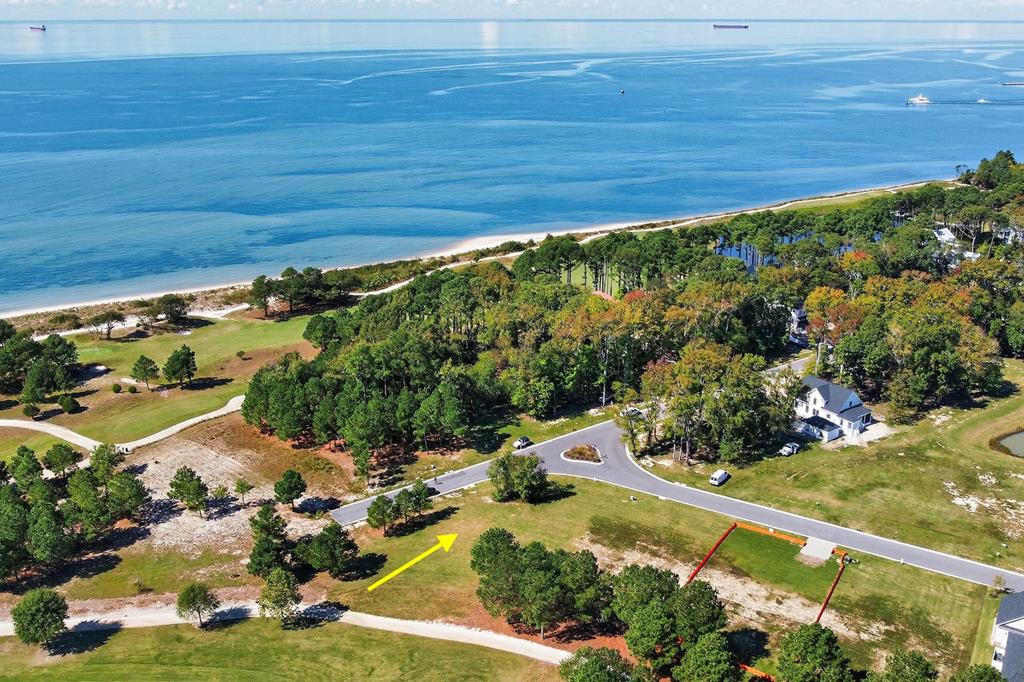 Build your custom coastal dream home on this large corner homesite in Muirfield at Bay Creek. Ideally positioned, this property offers a perfect setting for a thoughtfully designed home—some plans may even capture views of the Chesapeake Bay. The homesite backs to the 7th hole of the Nicklaus Course, with scenic views of Aberdeen Lake creating a peaceful and picturesque backdrop. Enjoy the unmatched lifestyle Bay Creek has to offer, including a private two-mile beach, championship golf,  pools, fitness center, new pickleball courts, and a 350-acre nature preserve. Just a short golf cart ride to the historic district for shopping, dining, and year-round events. Come walk this homesite today and envision the possibilities!