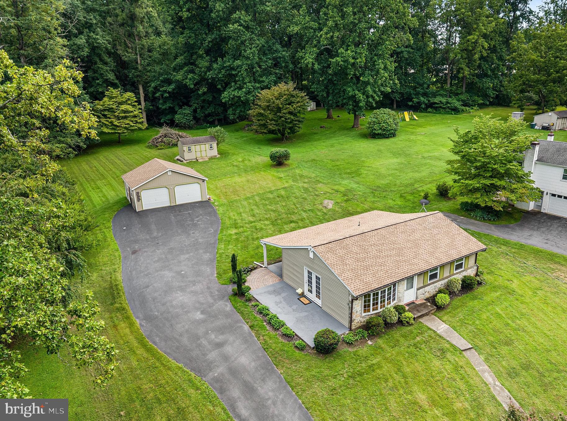 Small house, big country energy - and some pretty great updates already checked off the list! Tucked onto 1.2 acres in lovely West Nantmeal Township, this charming little ranch has a new roof and central air in 2025, new water heater in 2024, and new siding in 2023. Add in a two-car detached garage built in 2014, a large shed, covered back porch, and concrete patio, and this petite package has a whole lot going for it.Inside, the living room and dining area feature hardwood floors, and a big bay window floods the space with natural light. The kitchen has plenty of cabinet space, a butcher block countertop, and a large stainless sink. The bedrooms are cozy, making this a great fit for anyone who likes the idea of simple living, less space to clean, and more time to actually enjoy life. A full hall bath with a walk-in shower finishes this level.The lower level gives this little ranch some bonus breathing room, with epoxy floors and multiple finished living areas ready for movie nights, hobbies, a home office, workout space, or whatever else you can dream up. There's also a laundry room and full bath down here, making the lower level surprisingly useful.Outside is where this property really gets to show off. The large covered back porch practically demands a comfy chair and a cup of coffee, while the concrete side patio is ready for the grill. The detached two-car garage offers plenty of room for vehicles and projects, and the large shed means there's space for the mower, kayaks, tools, and all the other stuff you don't want cluttering up the garage.And speaking of those kayaks - Struble Lake is just a few minutes away, so you can be on the water without making a whole production out of it.It's not a big house, and that's kind of the point. Less house to fuss over, more land to enjoy, great outdoor spaces, plenty of storage, and a sweet country setting. Sometimes little really does have a lot going for it.