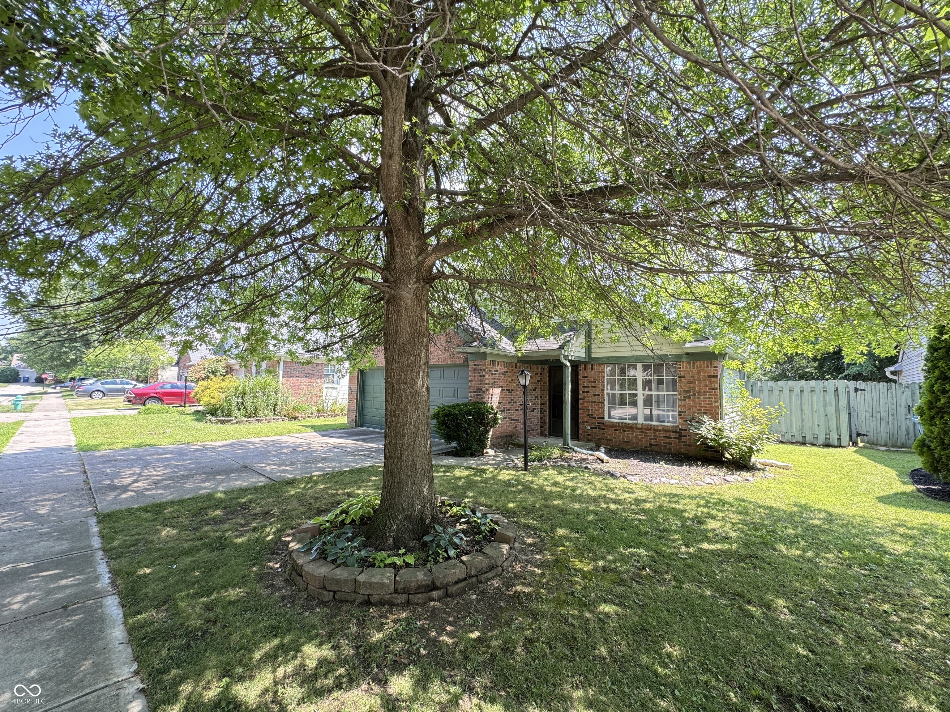 Welcome to this easy-living ranch tucked away in a quiet Fishers neighborhood with convenient access to parks, shopping, and dining. This well-maintained 2-bedroom, 1.5-bath home offers 852 square feet of functional, single-level living space. Fresh interior paint and brand-new carpet throughout make it move-in ready, and the recently serviced HVAC ensures year-round comfort.    Inside, the spacious living room is filled with natural light and flows easily into the kitchen. The efficient layout makes great use of space and offers a comfortable, low-maintenance lifestyle that's ideal for first-time homebuyers. Out back, you'll find a fully fenced yard-perfect for pets, gardening, or simply relaxing in privacy. The home is being sold as-is, offering a great opportunity to move into a clean, updated space in a desirable Fishers location. Simple, practical, and full of potential-this charming ranch is ready to welcome you home.