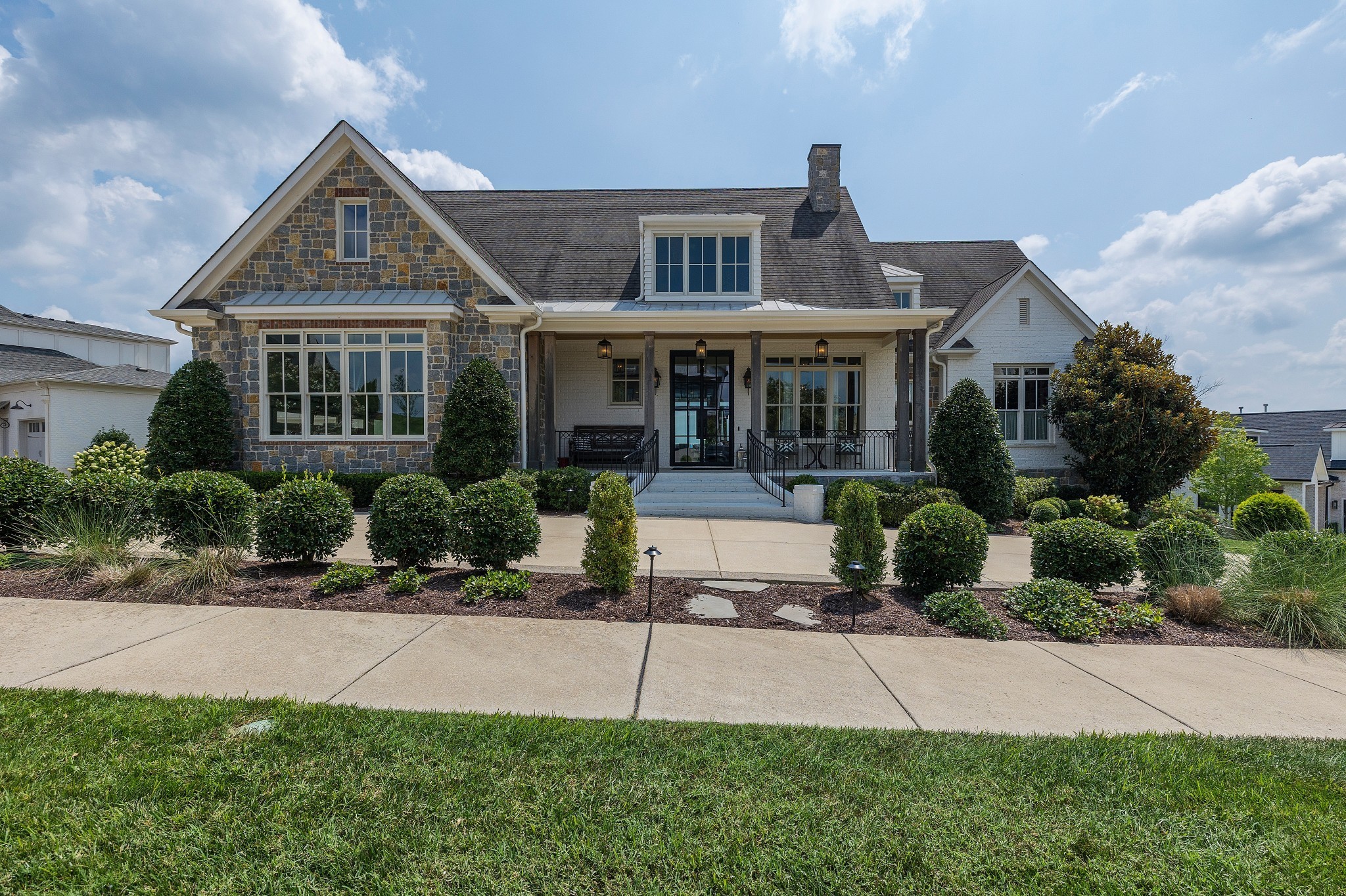 Located at Troubadour Golf & Field Club, this custom home was built in 2017. The home sits on 0.44 acres and has 7,017 square feet with five bedrooms, five full bathrooms, and two half bathrooms. The view is of hole #9 on Troubadour's Tom Fazio-designed 18-hole championship golf course. Throughout the main floor, there is an open flow between the gourmet kitchen, the living room, and the dining room. There is also a pool, a large basement with wet bar, and a double covered porch at the back that extends the living space.