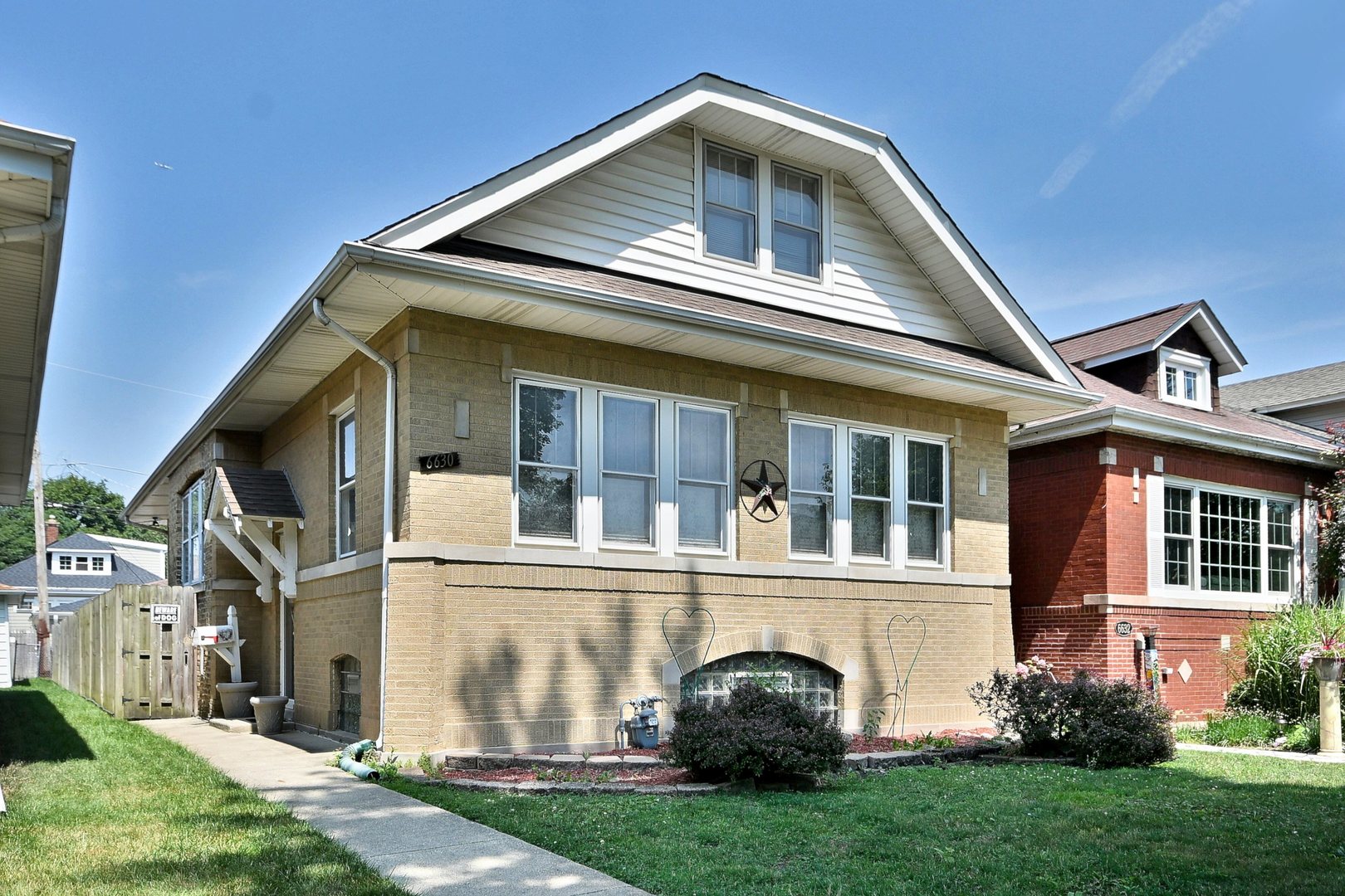 Nestled in the heart of highly desirable Edison Park, this charming brick bungalow presents a rare opportunity to own a well-loved home in one of Chicago's most sought-after neighborhoods. With 3 bedrooms and 3 full bathrooms, this home has been owned and cared for by the same family for many years. It has been meticulously maintained, offering solid bones and a strong structural foundation, though it's ready for your personal updates and modern touches.  Step inside to discover the classic layout of the main level, featuring hardwood floors beneath the carpeting, a spacious living room, a separate formal dining room, and a bright eat-in kitchen. The first floor also includes two comfortable bedrooms, a full bathroom, and an enclosed back porch  The upstairs level is ideal for extended family living, complete with a large bedroom, a full bathroom, a cozy family room, and a second kitchen. This flexible layout allows for related living or change back into single family.    The semi-finished basement with an exterior entrance adds even more living space with a full bathroom, laundry area, and plenty of storage options. It's a great space for a recreation room.  Basement also includes a room that can be used as a 4th bedroom.    This home also features a newer furnace and hot water tank, providing peace of mind for future owners. While the interior could use many updates, its excellent maintenance history and quality construction offer a perfect canvas for your vision.   Situated in a prime location, you'll enjoy being just steps away from top-rated schools, restaurants, local shops, parks, and everything that vibrant Edison Park has to offer. Whether you're taking a stroll through nearby parks, dining out, or commuting via the Metra, convenience and community are at your doorstep.  This is a rare opportunity to own a solid, spacious, and well-maintained home in an unbeatable location-don't miss your chance to make it your own! Livable but needs updating. Estate sale being sold in as is condition.