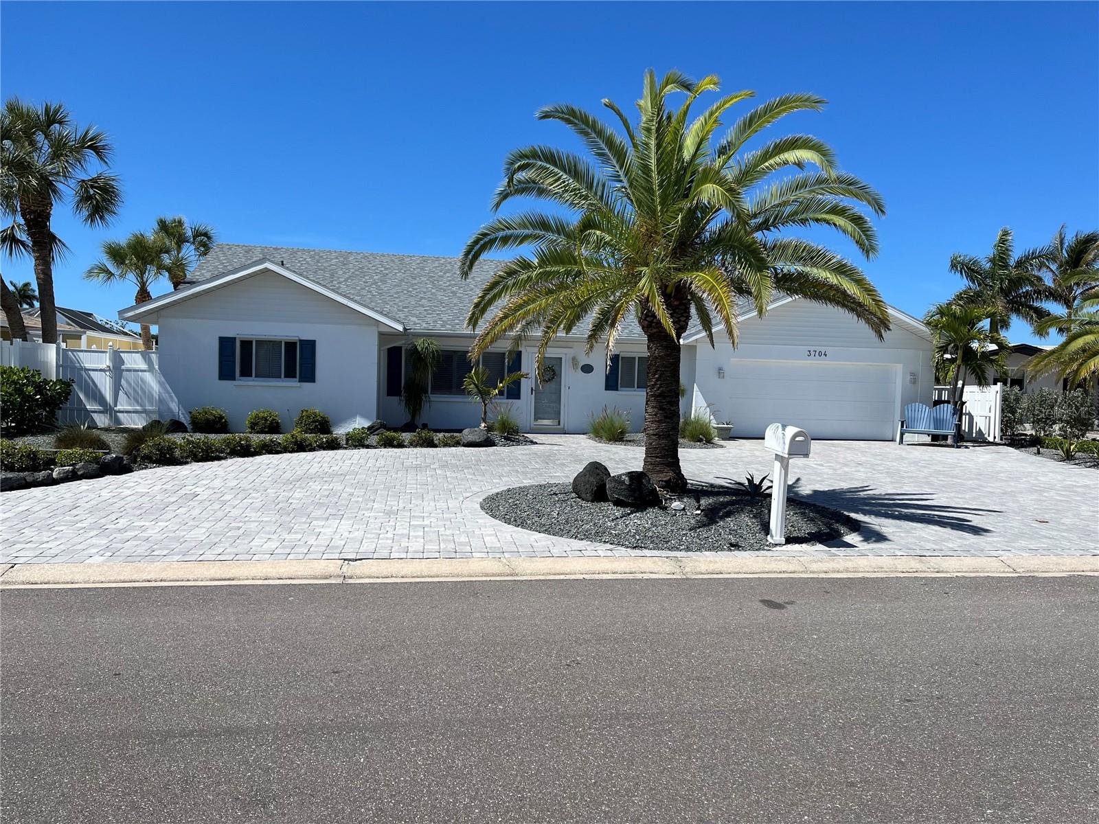 Enjoy a coastal home directly off Palma Sola Bay offering sailboat water to the Intercoastal and Gulf of Mexico.  Be minutes away from the pristine beaches of Anna Maria Island and Longboat Key.Experience stunning sunsets while sitting on your own dock of the bay with manatees and dolphins swimming directly beneath you.The home did not incur any damage or intrusion of water from the hurricanes of 2024.  The bricked backyard has been tastefully remodeled for hours of enjoyment for you and your guests.Several rooms have extra-wide door openings for those with mobility difficulty.  The kitchen is a chef's delight with cabinets made by the Amish and Corian countertops.  The roof was replaced in 2025.  Waterlines and attic duct work have been updated and replaced in recent years.Enjoy hours of boating as well as other water activities as you travel to the Intercoastal and Gulf of Mexico from your own backyard!  Truly, this home gives meaning to "living in Paradise".