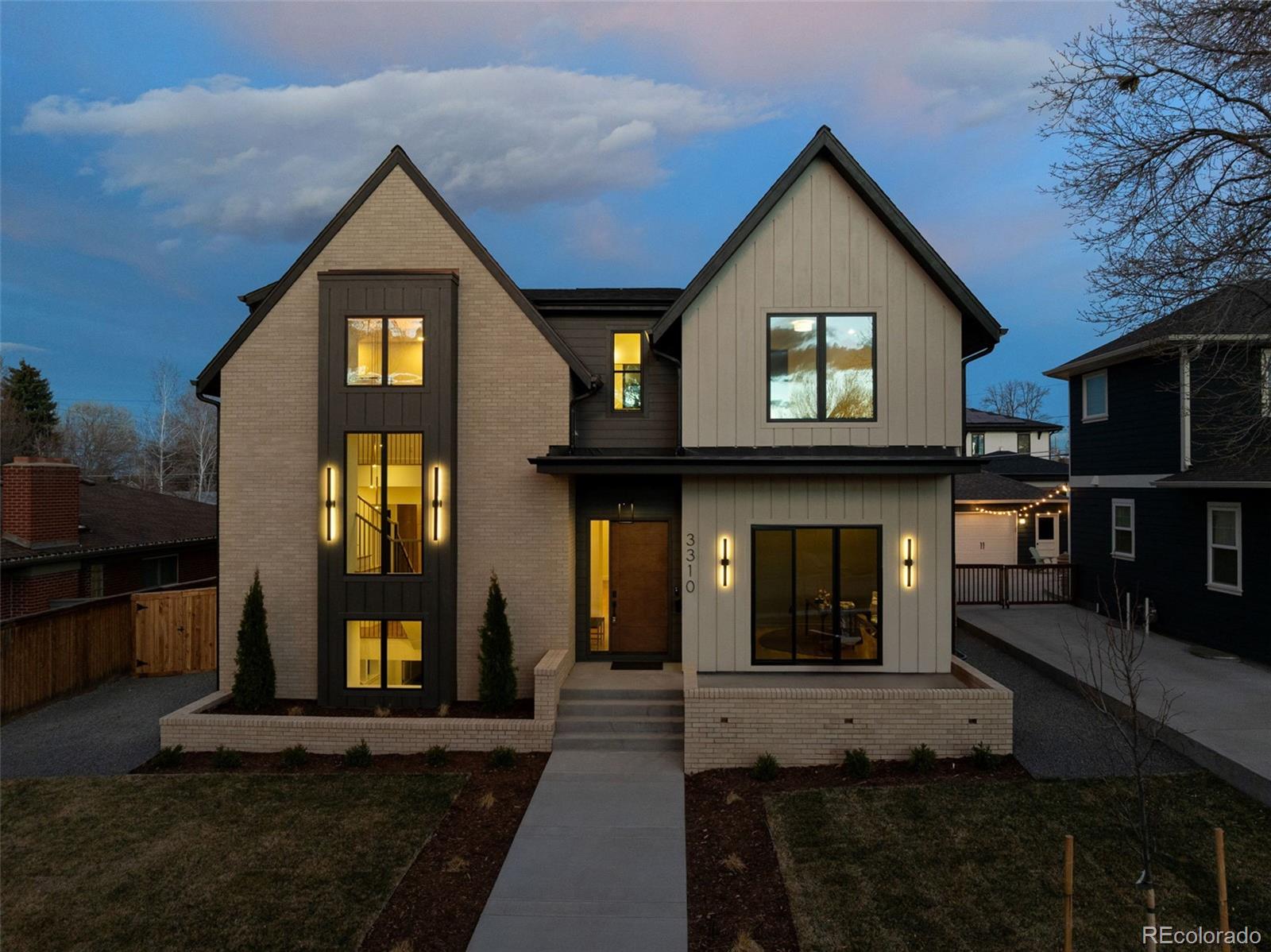 Built by Evolve Custom Build with architecture and interiors by the McAtee Studio, this exceptional new construction offers over 5,200 sf of thoughtfully designed living space on a 7,810 sf lot. Clean architectural lines and an extra-wide front walkway create striking curb appeal, while inside, 6” white oak floors, custom millwork, and designer finishes bring warmth and sophistication throughout. Ideally located one block from Eisenhower Park and the Highline Canal Trail. The main level is designed for everyday living and entertaining. The chef’s kitchen features white oak cabinetry, a thickened-edge island, a custom 8’ hood, Visual Comfort pendants, and a full JennAir appliance suite including a 48” induction range, integrated refrigerator, freezer, and wine fridge. A butler’s pantry with sink and microwave connects to a walk-in pantry. The dining room is framed by floor-to-ceiling windows and designer wallpaper, while the living room showcases white oak beams, a fireplace with tile surround, built-ins, and a statement wall. A sliding door opens to a covered patio with a stained wood ceiling and landscaped backyard. A main-floor office offers privacy with custom trim, a closet, and its own patio. Upstairs, the primary suite features vaulted ceilings with beams, oversized windows, and a spa-like bath with heated floors, soaking tub, oversized shower, and custom storage. The laundry room includes cabinetry and a sink. Secondary bedrooms offer walk-in closets and ensuite baths. The finished basement includes a wet bar, large living area with natural light, two bedrooms with walk-in closets connected by a shared bathroom, a flexible bonus room, and storage. Built for performance, the home includes Bosch heat pump HVAC, an energy recovery ventilator, steam humidification, and smart-home features. An oversized attached two-car garage adds convenience. A rare opportunity in University Hills, blending timeless design, modern systems, and exceptional craftsmanship.