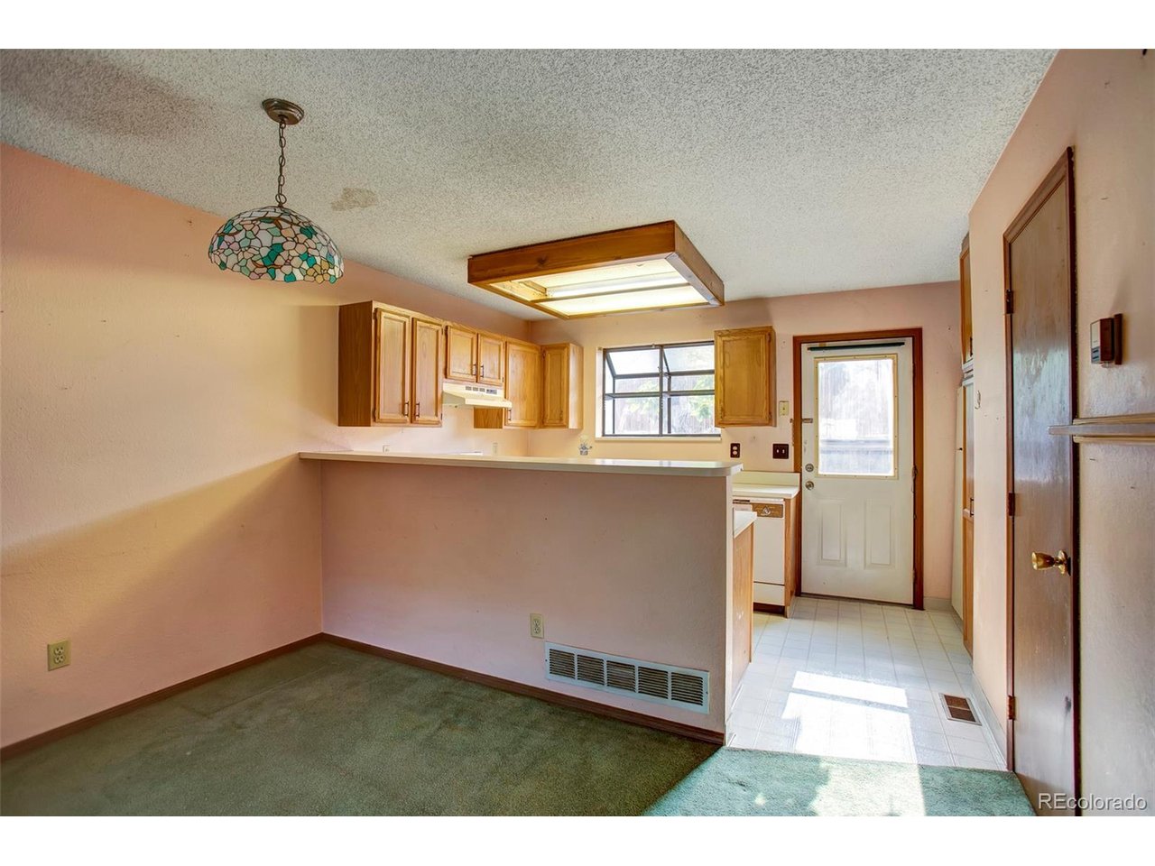 Bring your tool belt and vision to Crestline Park Townhomes! This 2-bedroom, 2-bathroom townhome is full of potential and ready for your personal updates. The main level features a living room with a cozy fireplace, a kitchen awaiting your design ideas, a dining area, and a convenient half bathroom. Upstairs, you'll find two bedrooms and a full hall bathroom. The unfinished basement provides endless possibilities for additional living space, a home gym, workshop, or extra storage. Conveniently located near Belleview Park, Cornerstone Park, downtown Littleton, shopping, dining, and the RTD Light Rail, this home also offers easy access to Santa Fe Drive, C-470, and the South Platte Trail system, making commuting and outdoor recreation a breeze. Whether you're looking for your next home or an investment opportunity, this townhome is ready to be transformed into something special.