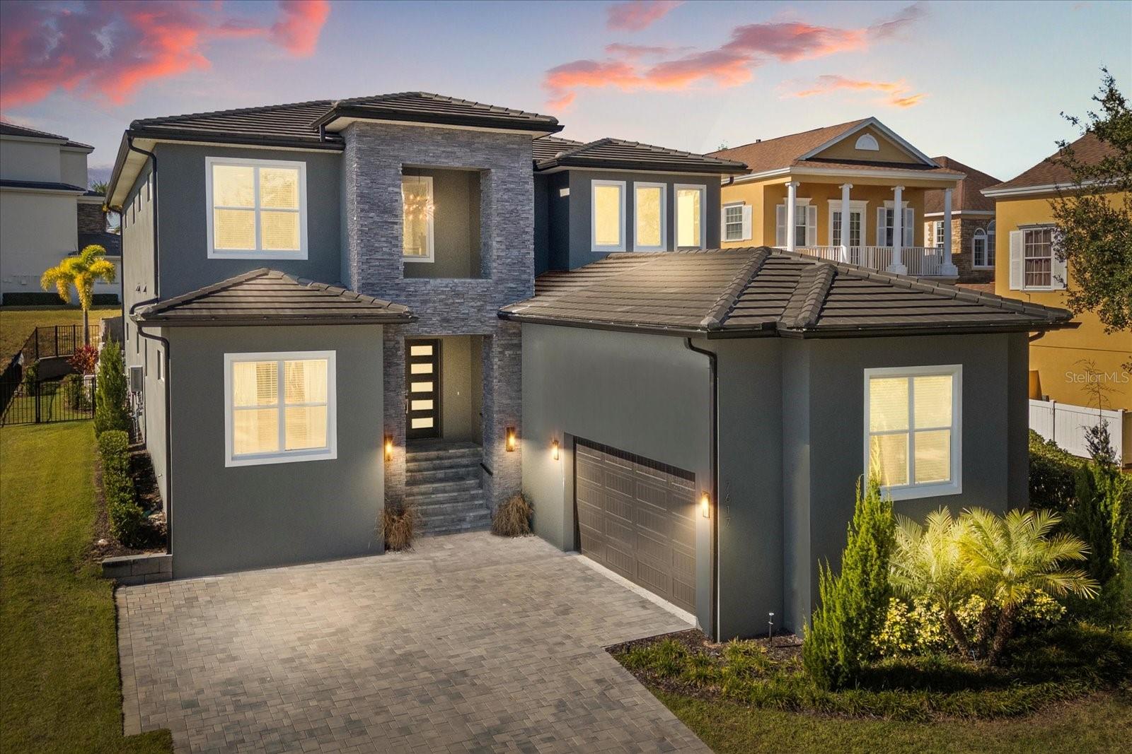 OPEN 1/28/2026 Home offered with a REUNION RESORT MEMBERSHIP*** This 6 bedroom 6 ½ bathroom property has everything you never knew you always wanted and then some.  This double lot build property is located in the most researched community in the Disney Corridor, Reunion Resort, and now you have a chance to call it your own.  A custom-built 2024 home with over 5800 square feet of entertainment space, luxury finishes, custom theming and a WATERPARK in the backyard! Appliances, flooring, and color palettes were all designed and very well thought out.  A complete TURNKEY OPPORTUNITY with "$" on the books for 2026 reservations.  Please look at the pictures at least 3 times to take it all in.  Pictures 4 and 22 are my favorite.  Pulling into the oversized drive, you know you have arrived. The homes large double doors and entrance are just the start of welcoming you to the open floor plan. Once inside, the home then wraps its arms around you and invites you to see more. Clean, fresh and Florida Perfect, this home makes sure not an inch is wasted.  The living space is comfortable, the kitchen is large and versatile, the dining room space is a great jumping point off for the day, or the place a family gathers around at night to recount the events of the day.  The first floor is complimented by two master suites that are well thought out and include custom design features.  If you love Florida living remember it’s not only what’s inside, but it’s also about what’s outside.  The outside space of this home is like none other in the resort and comes with its very own pizza oven!! Included in the outdoor space is a custom water slide and GROTTO, a sun-lovers dream ray catching area, a putting green, a fire pit, tons of paver patio space, a covered outdoor kitchen area, and just the right spot to grab an afternoon snooze.  REUNION HAS IT'S OWN STADIUM and it fits perfectly into this oversized garage space.   With VIP seating, every sports arcade game you can think of, a custom slide and THE ONLY REUNION JUMBO-TRON, this property has it all under the same roof.  If you are still reading this- yes there is more!  The second story is more impressive than the first.  Adults deserve a space for themselves as well, and the loft is the perfect homage to Casino Night with your own roulette table, slot machines, bar area and private balcony. The theming continues in two of the bedrooms upstairs.  In the Jurassic Park themed room you may just see Chris Pratt training Velociraptors, but if you miss him I know for sure you can spend the night in the custom Jeep from the classic movies.  Maybe you REALLY want to go glamping under the stars and not worry about Dinosaurs, then the next themed room might be for you!  Your very own custom Winnebago bunk is tucked inside this second themed room and you never have to empty the tanks!   It even has its own ladder and real tires.  Sounds like it’s too much to list and it’s because it is.  READY FOR THIS- THE LOT NEXT DOOR is ALSO AVAILABLE TO PURCHASE.  Can you imagine what the possibilities could be for this property, or should I say mini-resort? A double lot 2024 build, fully rental ready, with an active Reunion Resort Membership, next to an empty lot that you can also purchase for any future plans you may have. This is your UNICORN! *ACTIVE REUNION MEMBERSHIP*