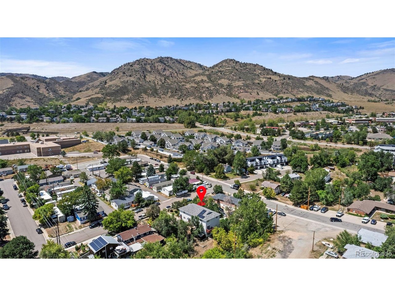Last chance before this townhome is taken off the market and rented out! Live the ultimate Colorado lifestyle in the heart of Golden! This beautifully remodeled 5-bedroom, 3-bathroom townhom-style home perfectly balances modern, carefree living with a prime, high-demand location. Step inside to find an updated interior featuring a brand-new kitchen, fresh custom paint, and new bathroom vanities. The rare, spacious 5-bedroom layout offers incredible flexibility and income potential as a rental. It is equally suited as a vibrant primary residence with space for a home office, or as a turnkey, low-maintenance asset with a proven, highly successful history of attracting Golden's strong housing demand.  Location is everything. Outdoor adventures are right outside your door, with world-class mountain biking, hiking, kayaking, and climbing just minutes away. When you are not on the trails, take a short stroll into downtown Golden or the Colorado School of Mines campus to enjoy weekly festivals, seasonal farmer's markets, top-tier restaurants, and local shopping. The property is situated just two blocks from Mitchell Elementary, while public transit users and commuters can catch the Ore Cart bus line just one block away. Complete with a budget-friendly, low-cost HOA, one reserved parking space, and plenty of street parking, this versatile property is a rare find in Golden's competitive market.  Brand new furnace and central AC! Schedule your tour today!