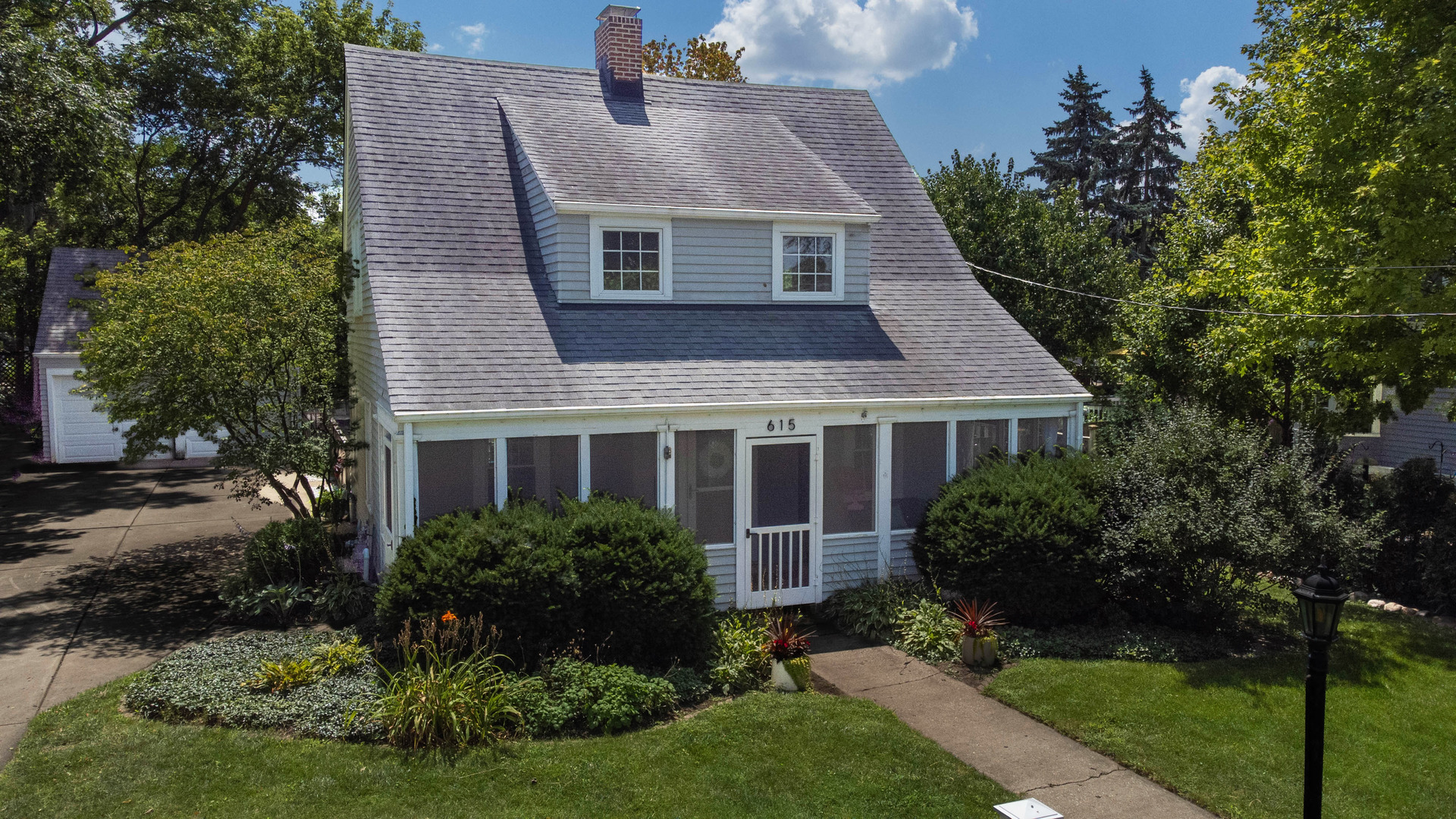 Gorgeous, updated home in the heart of downtown St. Charles! Enjoy walkability to parks, schools, festivals, shops, and restaurants from this charming property nestled on a beautifully landscaped lot with a fenced backyard and patio. An inviting enclosed front porch with flagstone flooring welcomes you into a light-filled home with windows on all four sides and tasteful neutral decor. Inside, you'll find a warm blend of original character and modern updates. The living room features a cozy fireplace and built-in bookcases, while the formal dining room offers a built-in hutch and refinished hardwood floors. The spacious kitchen opens to a large family room addition-perfect for entertaining. Upstairs, hardwood floors continue through generous bedrooms, including a primary suite with sitting room and brand-new ensuite bath (2024) featuring Kohler fixtures and a tankless water heater with recirculating line. Additional updates include: partial remodel of the 2nd floor bath (2025), new carpet in bonus room (2025), updated lighting throughout (2023-2024), and a remodeled main-floor full bath (2025). Enjoy peace of mind with newer forced air heat (2023), central air (2022), upgraded insulation (2023), and a 1.5" copper water main (2024). Radiators have been removed, making way for efficient modern comfort. Exterior highlights include a newer roof (2011), LeafFilter gutter guards, mostly newer Feldco windows, dual garage door openers (2023), a wood privacy fence (2022), decorative stone (2025), native parkway plantings, and extensive landscape improvements (2021-2025). Full unfinished basement, 2-car garage, and plenty of off-street parking. Truly move-in ready with thoughtful updates, timeless style, and a location that can't be beat-this is the one you've been waiting for!