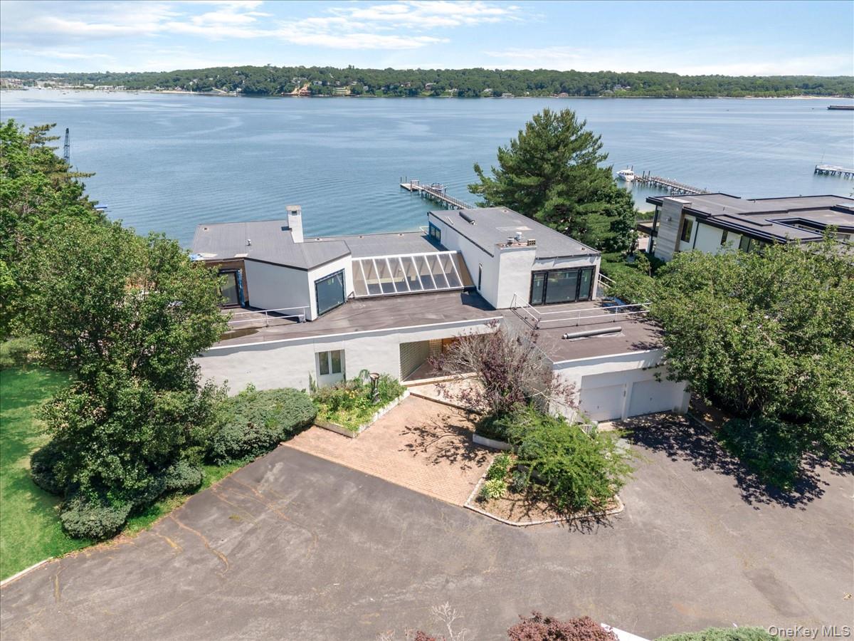 A truly exceptional waterfront estate in the prestigious Harbor Acres community of Sands Point. Privately set on approximately 2 acres, this remarkable property offers sweeping water views, direct private beach access, and a rare sense of tranquility and seclusion. The 5-bedroom residence features graciously proportioned living and entertaining spaces designed to capture the beauty of its waterfront setting. Expansive grounds provide an extraordinary backdrop for outdoor entertaining and relaxed coastal living. Residents also enjoy access to the exclusive Harbor Acres Beach Club, offering tennis courts and recreational amenities. An extraordinary opportunity to own a premier waterfront property in one of Sands Point’s most distinguished enclaves.