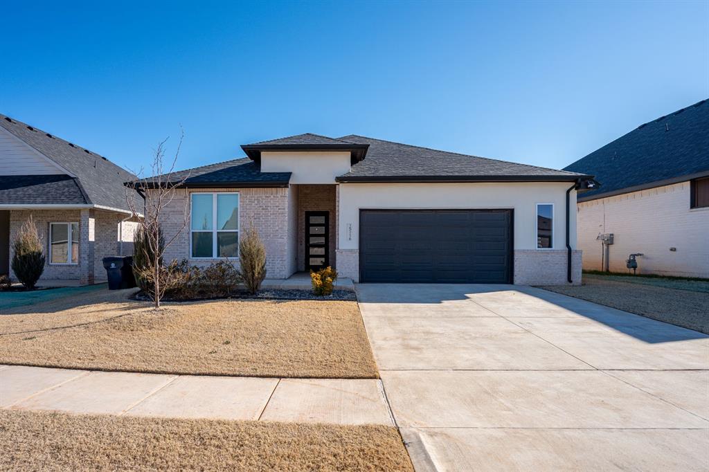 Gorgeous home featuring beautiful finishes throughout and wood-look tile flooring in the main living areas. The spacious living room offers vaulted ceilings and a stunning fireplace, creating a warm and inviting atmosphere. The kitchen is designed for both everyday living and entertaining, complete with an oversized island, cooktop range, built-in oven, floor-to-ceiling cabinetry with under-cabinet lighting, breakfast bar, and a pantry. The split floor plan provides added privacy, with the primary suite offering a spa-like bathroom that includes a soaking tub, separate glass-enclosed shower, dual-sink vanity, and a large walk-in closet with direct access to the laundry room. Step outside to enjoy the covered patio and fully fenced backyard—perfect for relaxing or hosting guests. Neighborhood amenities include a community pool, park with basketball court and playground, scenic pond, and fitness trails. Conveniently located just minutes from John Kilpatrick Turnpike access, as well as nearby shopping and dining. Don’t miss this one—schedule your showing today!