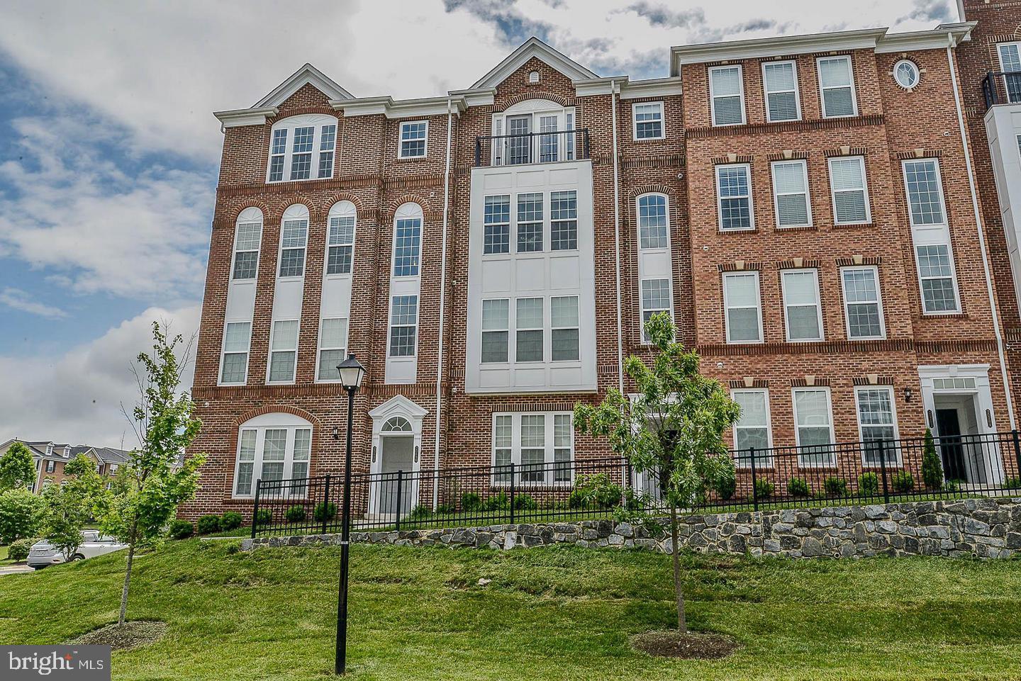 Welcome to this beautifully upgraded end unit condo style townhome in the sought after Townes community of Ashburn. This home offers an open and inviting floor plan with quality finishes throughout, including upgraded hardwood flooring in the main living areas and upper level bedrooms, upgraded granite surfaces, premium crown molding, and tasteful window treatments.The main level features a bright living area, designated dining space, and a well appointed kitchen with an island, breakfast area, table space, and direct connection to the family room, making the layout ideal for everyday living and entertaining. A private balcony provides a nice outdoor extension of the living space.Upstairs, the spacious primary suite has been thoughtfully enhanced to feel open, airy, and comfortable, featuring a walk in closet and private bath. The upper level also includes convenient bedroom level laundry and well sized additional rooms. With 2 full bathrooms, 1 half bathroom, and an attached garage, this home offers both comfort and function.The location is a major highlight, just minutes from Goose Creek Village Center with Harris Teeter, restaurants, coffee shops, fitness studios, retail, and everyday conveniences nearby. Commuters will appreciate easy access to Route 7, Route 28, the Dulles Greenway, Silver Line Metro stations, Dulles International Airport, and the One Loudoun corridor. A beautiful home in a highly convenient Ashburn location.