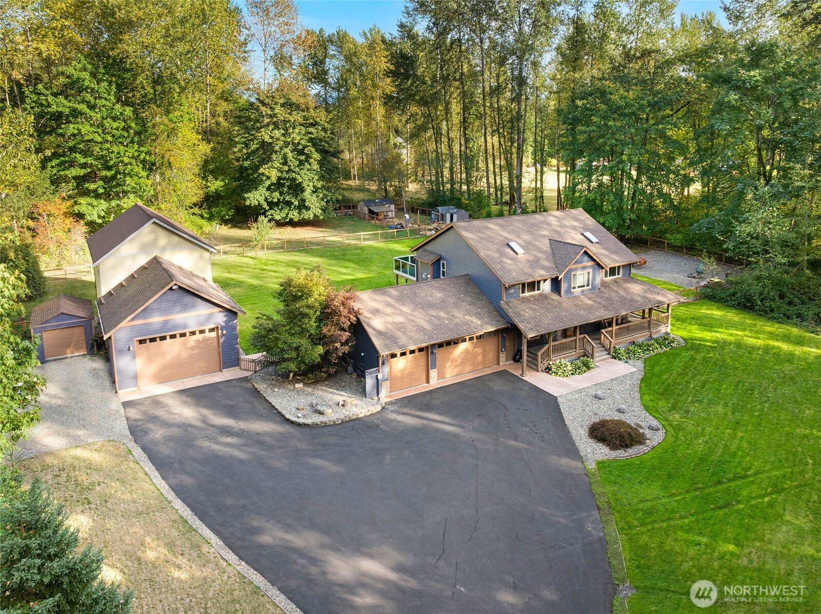 Tucked away down a long private road, this extraordinary property spans two tax parcels totaling over 10 acres, offering a rare blend of space and seclusion within an exclusive gated 8-home enclave. The 4-bedroom, 2.5-bath residence features two generous living areas, a chef’s kitchen with gas range, and three gas fireplaces—including one in the primary bedroom  with an en suite bath. Modern conveniences include a 3-car garage and a whole-home automatic gas generator. A massive shop with a second-floor loft and mini-split wiring provides exceptional flexibility for work, storage, or hobbies. A peaceful retreat that balances comfort, privacy, and versatility, all with convenient access to Hwy 167, SR-18, I-5, and I-405.