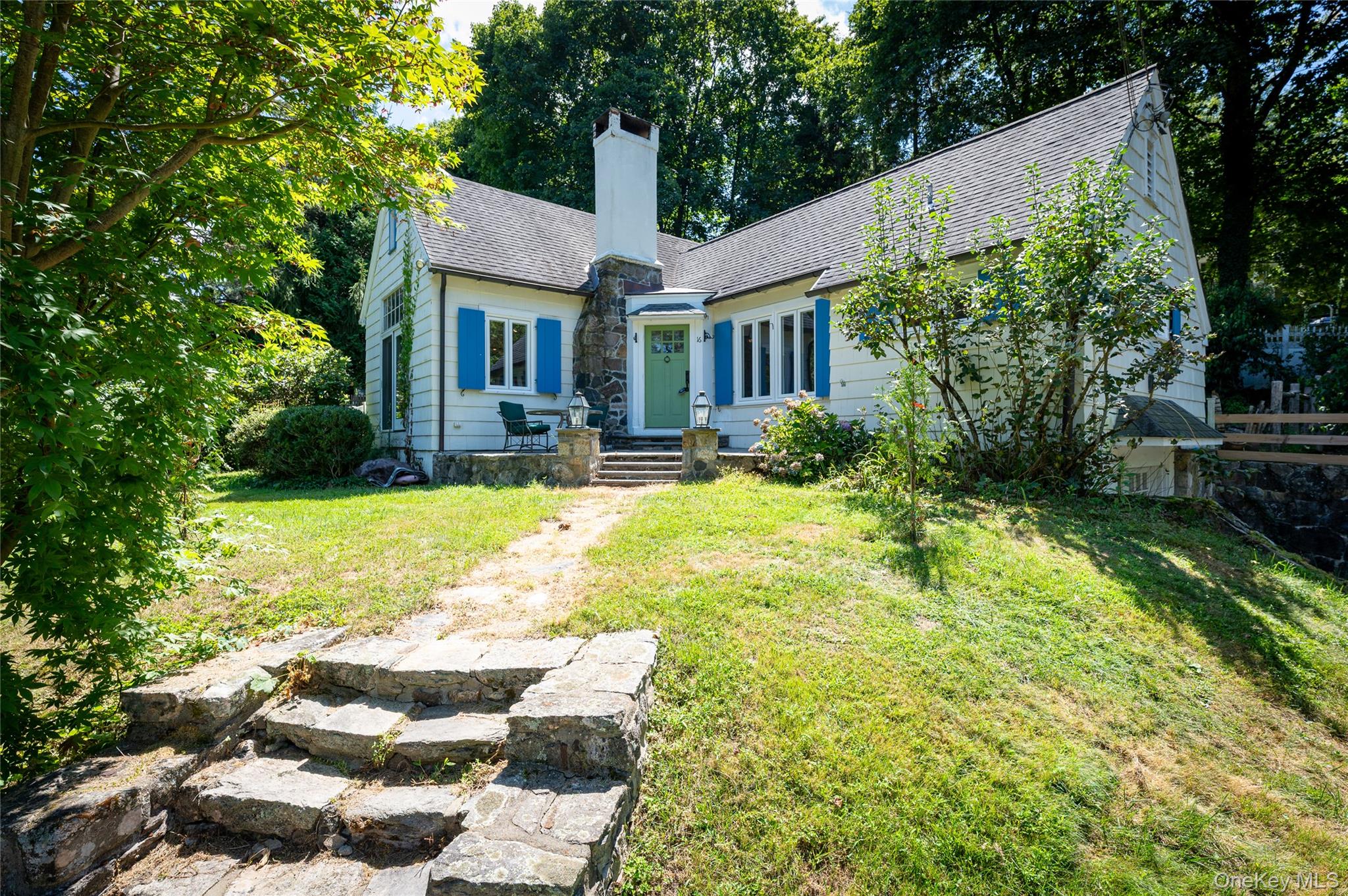This charming cottage offers classic period architecture and serene views of Lake Truesdale. The expansive living room has vaulted ceilings, exposed wood beams, and a stone fireplace. Large sliding doors allow for plenty of natural light. New energy-efficient windows were installed throughout the house less than a year ago enhancing the views from the kitchen and dining room. Inside, you'll find hardwood floors throughout and three bedrooms, including a versatile loft that works as a guest space or home office. The kitchen features custom white cabinetry, marble countertops, and a traditional farmhouse sink. Enjoy full lake rights and easy access to the TLPOA private beach—just a short walk away. This home located in an award winning school district is conveniently located minutes from Ridgefield, CT, 7 miles to the Katonah train, and only 60 miles from NYC. An accessible shuttle makes the commute to the Katonah train station a breeze. Commuter parking lots available to residents at $100 annually.