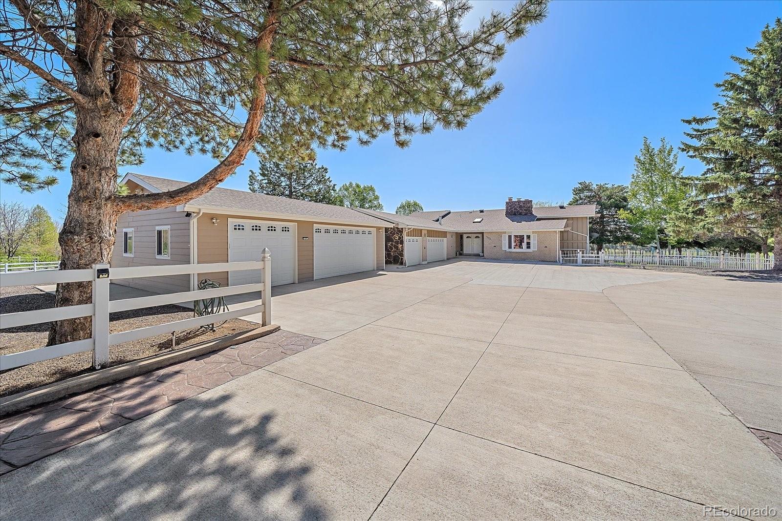 This is a once in a lifetime opportunity to make this beautiful and RARE property yours! 3 ACRES, horse property, NO HOA in the city! The sky is the limit for what you could do here. This 4 bedroom home includes a huge primary suite with fireplace, large walk-in closet and private balcony overlooking the property. Upgraded kitchen is open to family room that has access to the yard. The yard is an entertainers dream with a heated in-ground pool, hot tub, fire pits, tennis court all surrounded with mature trees landscaping the outdoor retreat perfectly for privacy. Car lovers bring your cars. There is a 3 car heated attached garage, 3 car detached garage, barn that includes RV garage, 10,000 lb extended height car lift with an additional 2 car garage, 22 ft width x 26 ft length x 11 ft eave height carport, 30 ft width x 20 ft length x 8 ft eave height car port. Horse lovers bring your horses. 3 horse stall barn with water, electrical, feeders and comes with brand new corral fencing (never used). Views of Denver and The Rockies. To have all of this with the LOCATION is a rare find!