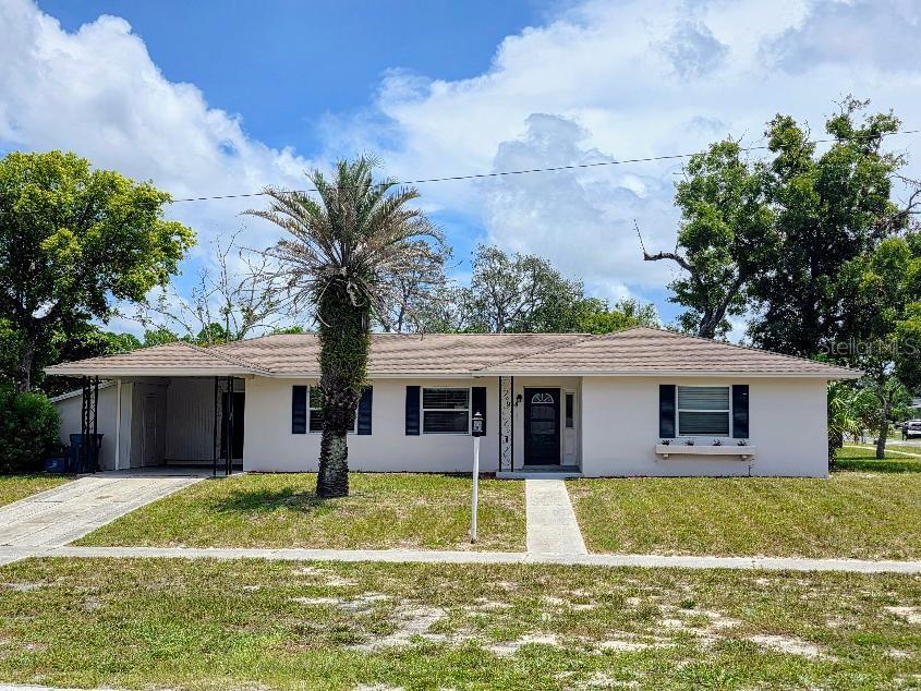 Great starter home situated on a large corner lot in Spring Hill. NEW ROOF being installed before closing! This home has been fully renovatedwithin the past 4 years. Luxury vinyl flooring, granite countertops, stainless steel appliances, custom backsplash, and designer faucets. Unique: two half baths that are connected by an oversized shower, easily accessed from the hall bathroom or master bath. Windows have been upgraded; AC is 3 years old; water heater is 2022; brand-new refrigerator and dishwasher. Separate laundry and storage room off the kitchen. Enjoy the privacy of a fenced-in backyard with pavers, and a screened-in lanai.