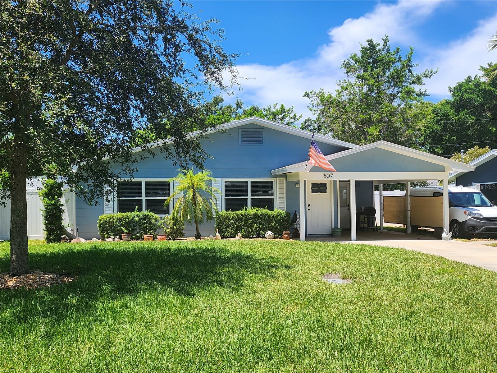 This beautiful House has many updates and improvements.  All new insulated windows, new front door, carport entry door, and back door. The rooms are all freshly painted for a sharp clean look. 
There is an extra room in the back that has 3 - 6 foot sliding glass door that open to a large screen room.  The view from there is the huge back yard with 2 beautiful trees and the Pinellas trail right through the gate. 
The kitchen is updated with all wood cabinets and modern appliances.  Through the kitchen to the large laundry room with another set of base cabinets with a counter-top and 2 more wall cabinets.  The door there goes to another concrete patio perfect for the BBQ grill.  Beyond that in the yard is another large patio to sit and watch the walkers and bikers pass by on the trail.
Each of the 2 bedrooms has a large closet with 2 shelves for plenty of clothes.
The bathroom is modern and updated, and just outside of the bathroom is a large closet with lots of shelves.
The living room and dining room are open and spacious for comfortable living. 
The side yard has another concrete pad with 2 large gate to bring in your boat or trailer for storage.
The property has PVC fence on 3 sides with gates on both sides and chain like along the back bordering the Pinellas Bike Trail. 
This really is a great house and will be a great home.