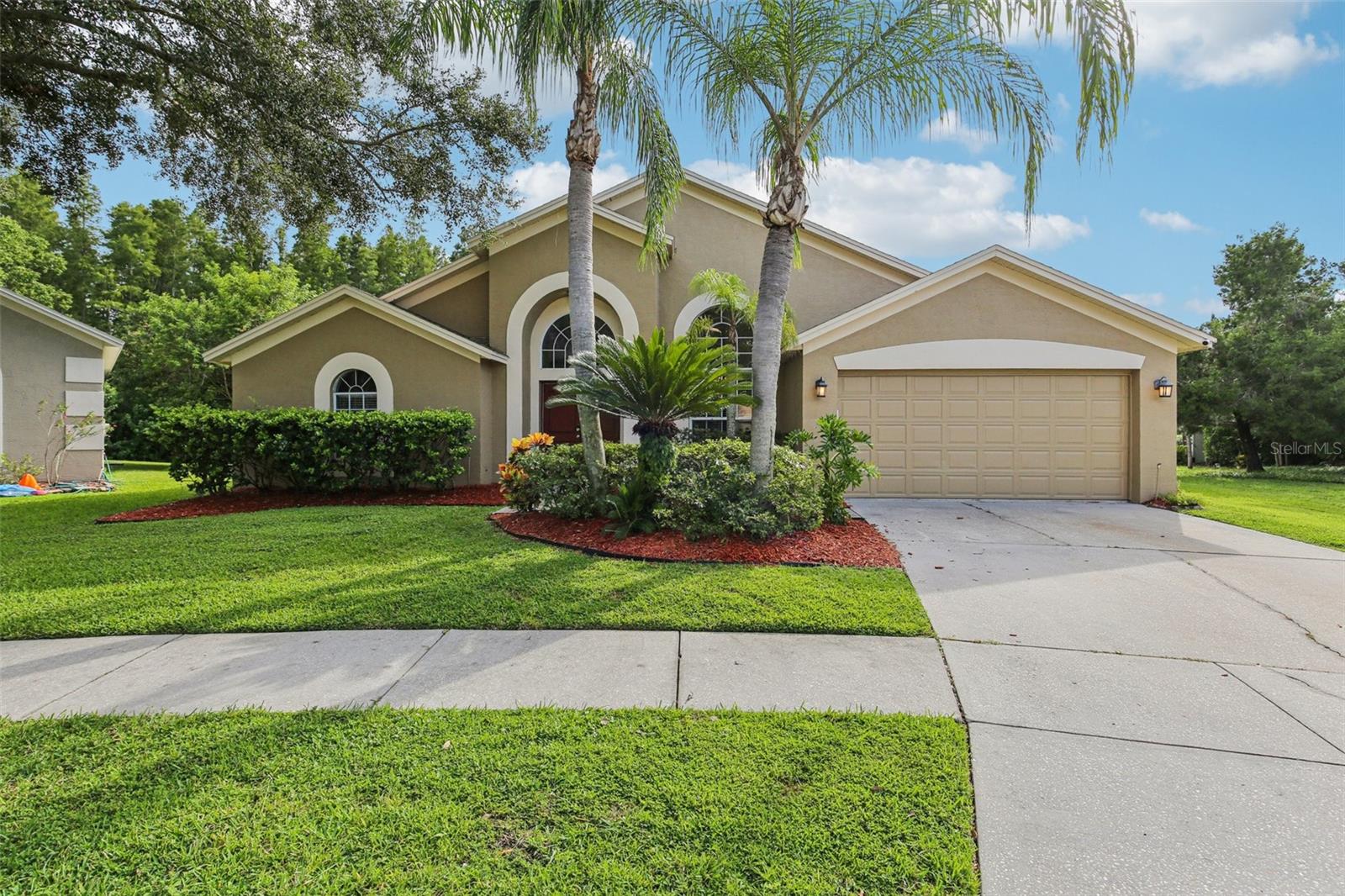Welcome to this beautifully maintained 4 bedroom, 3 bathroom pool home located in the sought-after community of Calusa Trace, known for its low HOA fees, no CDD, and top-rated schools. This home offers a functional layout with formal living and dining rooms up front and an open-concept kitchen and family room overlooking the screened pool and lanai. The split-bedroom floor plan provides privacy, and large windows bring in natural light with peaceful views of greenery and a pond—no rear neighbors.

Recent improvements include: roof (2016), plumbing re-pipe (2021), air conditioner (2020), new flooring in main areas (2021), pool pump (2024), pool filter (2025), interior and exterior paint and seal (2024), garage door opener (2025), new front doors (2024), and full lanai screen replacement (2021).
Location is everything – just minutes from shopping, dining, St. Joseph’s Hospital, the Veterans Expressway/Suncoast Parkway, and Tampa International Airport.
If you’re searching for a move-in ready home with a private pool, a smart layout, and the reassurance of recent big-ticket updates, this is the one!