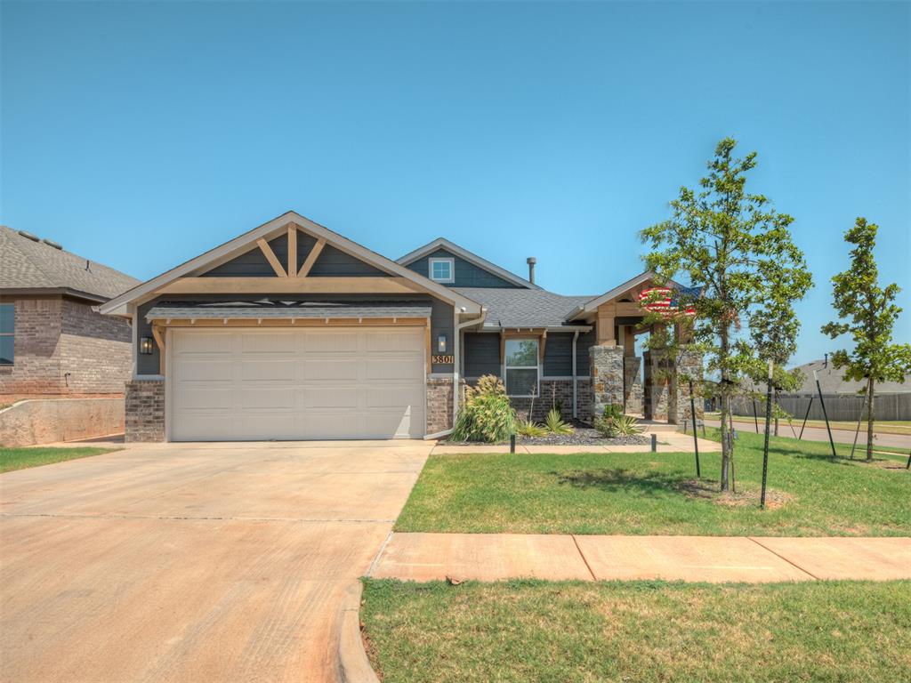 CORNER LOT, STORM SHELTER, REFRIGERATOR + WASHER/DRYER INCLUDED, UPGRADED LANDSCAPING  MOVE-IN READY! Welcome to Flint Hills, where beautiful design and thoughtful details come together in a home that truly stands out. Situated on a desirable corner lot, this mountain cottage offers upgraded landscaping, a fully fenced backyard, and a sprinkler system servicing the yard. Inside, an inviting open floor plan features durable hard-surface flooring throughout the main living areas and a beautiful fireplace creating the perfect focal point. The kitchen is both stylish and functional, showcasing elegant quartz countertops, a gas range, beautiful finishes, and plenty of space for everyday living and entertaining. The appliances are already here!** This home includes a top-of-the-line stainless steel refrigerator plus a Maytag washer and dryer, making it truly move-in ready and saving you the expense of outfitting your new home. The spacious mudroom just off the garage creates an ideal drop zone, while the utility room offers additional storage. For added peace of mind, the garage includes a built-in storm shelter. The private primary suite feels like a retreat, featuring a spacious ensuite with a large quartz vanity, dual sinks, beautifully tiled shower, freestanding soaking tub, linen storage, and an oversized walk-in closet. Enjoy the fully fenced backyard from the covered patio, perfect for relaxing or entertaining. Flint Hills is conveniently located along Tecumseh Road, approximately 5 minutes to I-35, 10 minutes to the University of Oklahoma, and less than 20 minutes to Tinker Air Force Base. Planned community amenities include fishing ponds, walking trails, a playground, splash pad, and soccer field. With an Ideal Homes 10-year structural warranty and additional home warranties, this is more than a beautiful home, it's a smart move. Don't miss your opportunity to make this exceptional Flint Hills home yours!