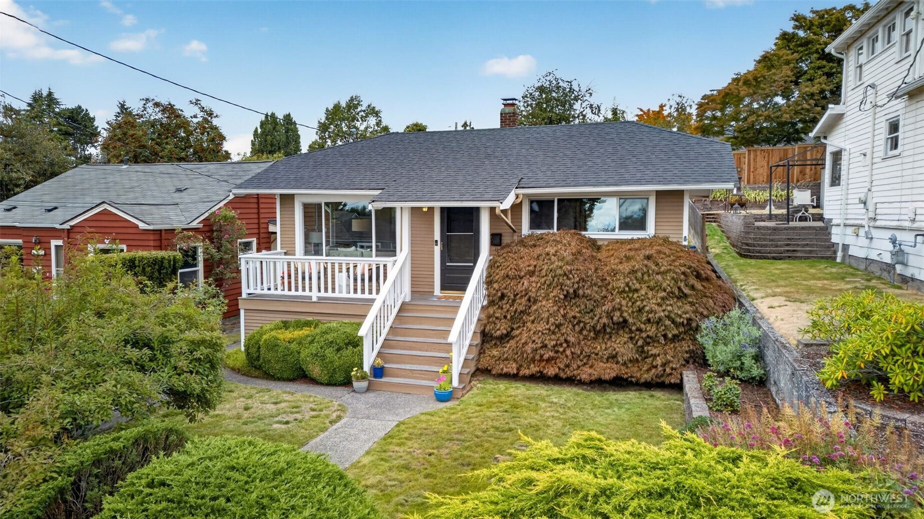 This wonderfully renovated, turn key home in the heart of Gatewood welcomes you with SW facing peak-a-boo views of the Sound & Olympics and charming rocking chair front porch. Living room features classic hardwood floors, large picture windows offering excellent natural light and a custom ceiling. The beautifully renovated chef’s kitchen is a standout, new cabinets, title backsplash & flooring, brand-new appliances, and sunny eating quarters. The main level offers two comfortable bedrooms and a well-appointed bathroom with a large linen closet, alongside a spacious laundry equipped with a full-size, front-loading washer and dryer. Downstairs, a massive unfinished basement provides excellent storage and the perfect footprint for a future expansion. Step outside to find an ideal fully fenced backyard, featuring a large patio and terraced planters. Detached garage. Completely turn-key, the home has been updated including: electrical, plumbing, sewer line, windows & more! Move right in and enjoy the best of West Seattle living!