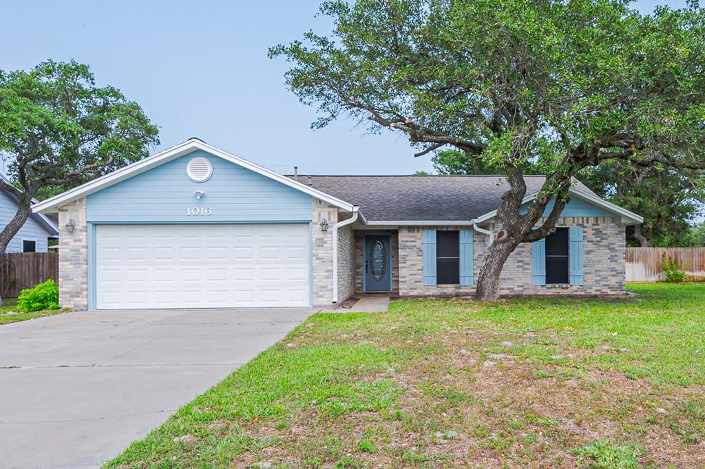 Featuring this well-maintained brick home in Rockport's Oak Terrace. With 1830 square feet located on a huge double lot, it has a nice layout with large living area and wonderful sunroom overlooking the spacious, fully fenced backyard.  All 3 bedrooms are spacious and ready to add your special touchperfect for a growing family.  Bright and fresh with new paint inside and out and new air conditioner and water heater. Covered carport has access through double at Mission Road entrance. Location is attractive with easy access to the bypass and close to Rockport's downtown area.  The home is extending a special invitation to it's new family to not pass this one up!