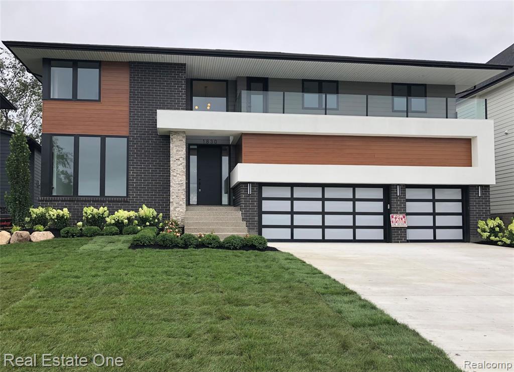 NEW CONSTRUCTION!  Built with the highest quality materials.  This is an exceptional home that you will be proud to own.  The minute you enter you will immediately realize that this is like no other home.  The expansive great room, dining room and well-appointed kitchen are the heart of this home.  The kitchen boasts LaFata  cabinets, stone countertops and built-in stainless/glass appliances.  Additional space in the huge walk-in  pantry for small appliances, etc.  Enjoy the large linear gas fireplace while looking out through the wall of windows to the spacious paver patio and water views.  The 2nd level primary suite boasts huge walk-in closet with custom shelving and mirror.  The primary bath has a free-standing tub and private shower and water closet areas.  Enjoy the peaceful view from the attached deck.  2nd bedroom has its own private bath.  Two additional bedrooms share a bath with tub/shower combo.  The 2nd level laundry includes washer and dryer.  The fully finished walk-out lower level has full bath and possible 5th bedroom or whatever you want it to be.  It has door walls to the large paver patio and grassy areas.  The home is connected on three levels by a gorgeous floating staircase.  The maple wood steps are complimented by glass railings.  The front balcony above the garage has a panoramic view of the subdivision common areas which include tennis and pickle ball court.  There is a huge three car garage which can house 6 cars by adding car lifts (not included).  All homes have been built in this gated community and there are no more lots available.  Everything designed and executed for luxury living.  Schedule your private showing. Listing agent related to seller.
