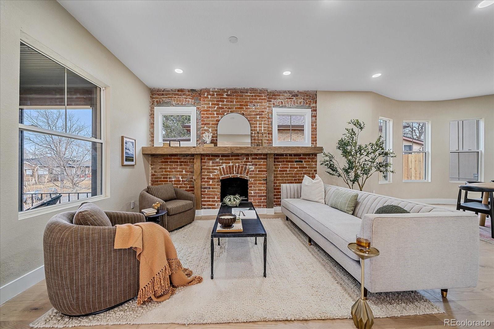 Originally built in 1907 and completely reimagined in 2025, this exceptional Highlands residence offers a rare blend of historic architecture and fully modern infrastructure — thoughtfully rebuilt for today’s lifestyle without compromising its character.As part of the renovation, a spacious 600-square-foot primary suite was added to the main level, creating true main-floor living — a feature seldom found in homes of this era. Designed as a private retreat, the suite elevates both comfort and functionality while honoring the home’s architectural integrity.Behind its timeless exterior, every major system has been replaced or upgraded, including all new plumbing, electrical, windows, furnace, A/C, tankless water heater, and a premium SPAN smart electrical panel with real-time energy monitoring from your phone. Smart switches and thermostat add seamless modern convenience throughout.The interior has been fully redesigned with all new flooring, fresh paint, new interior and exterior doors, and a striking kitchen featuring new cabinetry and appliances. Curated design elements — including a custom illuminated beam and architectural lighting feature in the primary suite — add distinction and warmth.Outdoor living is equally refined, with new sod, new fencing, a newly constructed back patio, and an additional side patio — ideal for entertaining or quiet evenings at home.Situated just blocks from the vibrancy of 32nd Avenue and Tennyson Street, you’ll enjoy effortless access to some of Denver’s finest dining, boutique shopping, coffee shops, and neighborhood favorites — all within one of the city’s most coveted communities.This is not a cosmetic remodel. It is a comprehensive reinvention of a 1907 classic — delivering historic presence with 2025 performance. A rare offering in the heart of the Highlands.