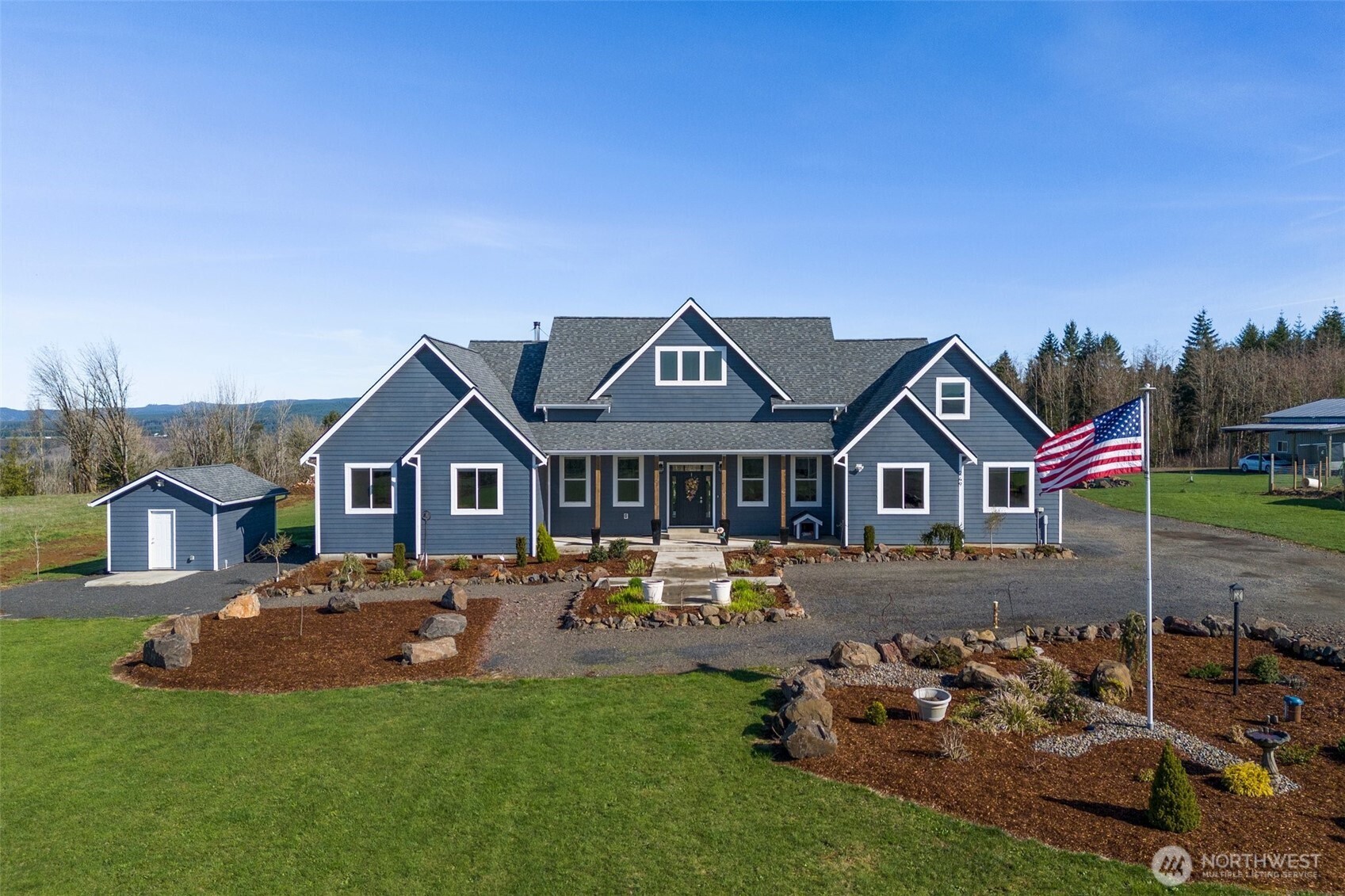Welcome home to this beautiful 5 bedroom home offering elegance and comfort. Step inside to an inviting open-concept living space with breathtaking territorial views framed by a large picture window. The living room features a stunning fireplace, while the spacious kitchen boasts a large Island, double fridge, and walk-in pantry, perfect for entertaining. Vaulted ceilings add to the airy feel, a dedicated office provides a quiet workspace. The luxurious primary suite offers an en-suite bath, ensuring a private retreat. Outside, enjoy the expansive covered porch, sports court, firepit, and a LARGE SHOP. Sitting on 10 acres, this home offers unparalleled 300-degree panoramic views, including Mt. St. Helens.