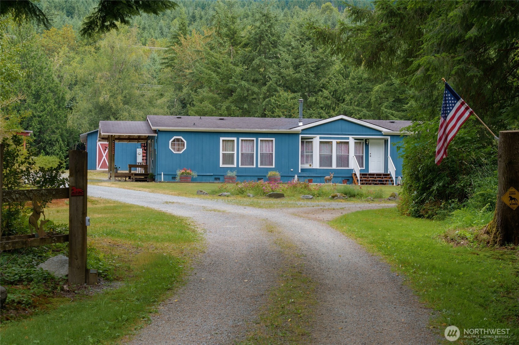 Desirable 14.26-acre Sedro-Woolley equestrian property along Hansen Creek! Formerly an equestrian obstacle course training facility, this unique property is thoughtfully designed for horse enthusiasts with multiple pastures, round pen, training obstacles, watering stations and power throughout. Adjacent to open space forest lands with direct access to miles of roads and trails! Numerous outbuildings include stables, storage sheds and machine/tractor shed. Two RV hookups, one with 30/50-amp service and the other a 30-amp service, are supported by a separate septic system and power meter. Included 5th-wheel trailer offers additional guest space or potential rental opportunity. The 1,620 sq ft home features 3 bedrooms, 2 full baths, spacious living room with forced air and wood heat, fresh interior paint and new carpet. Pre-inspection completed with repairs made for added peace of mind. A rare opportunity offering exceptional equestrian infrastructure, privacy and endless possibilities!