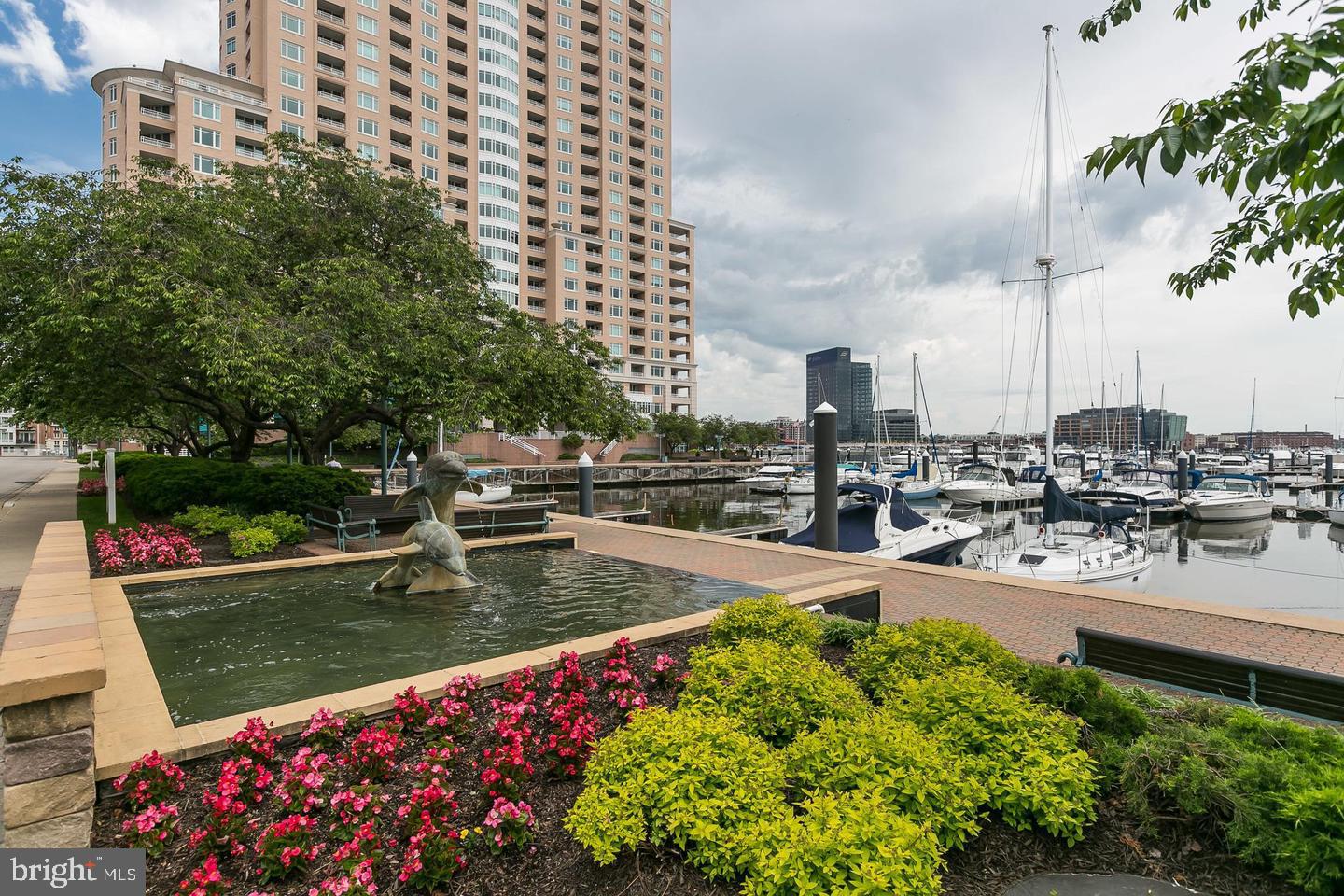 Spectacular AWESOME city and water views! Clean, bright apartment offers open LR/kitchen floor plan with 2 balconies! Highlights include 1,129 sf, stainless appliances, lots of counter top cupboard and pantry space, lots of light, decorative pendants and recessed lighting, W/D. Master Suite offers walk-in closet, private bath with dual bowl sinks, shower, Jacuzzi tub. Enclosed Den (or 2nd BR) with private 2nd balcony. Rent includes gated garage parking, water, extensive fitness center with steam, sauna, pools, hot tub. Outdoor grill area!  Luxury full service building with many value added amenities and services! 24/7 front desk concierge and valet, billiards, dining rooms, lobby social lounge with Internet access, conference rooms, guest suites, business center, discounted marina boat slips! Harborview Marina & Yacht Club grounds are beautifully landscaped with walking/jogging paths, seasonal flowers, water fountains. On-site gourmet deli, patio dining, banking, security staff, and plenty of guest parking!  Close to night life, shops, stadiums, business district, free public transportation, MARC train and 10 miles to the Airport! Available NOW!