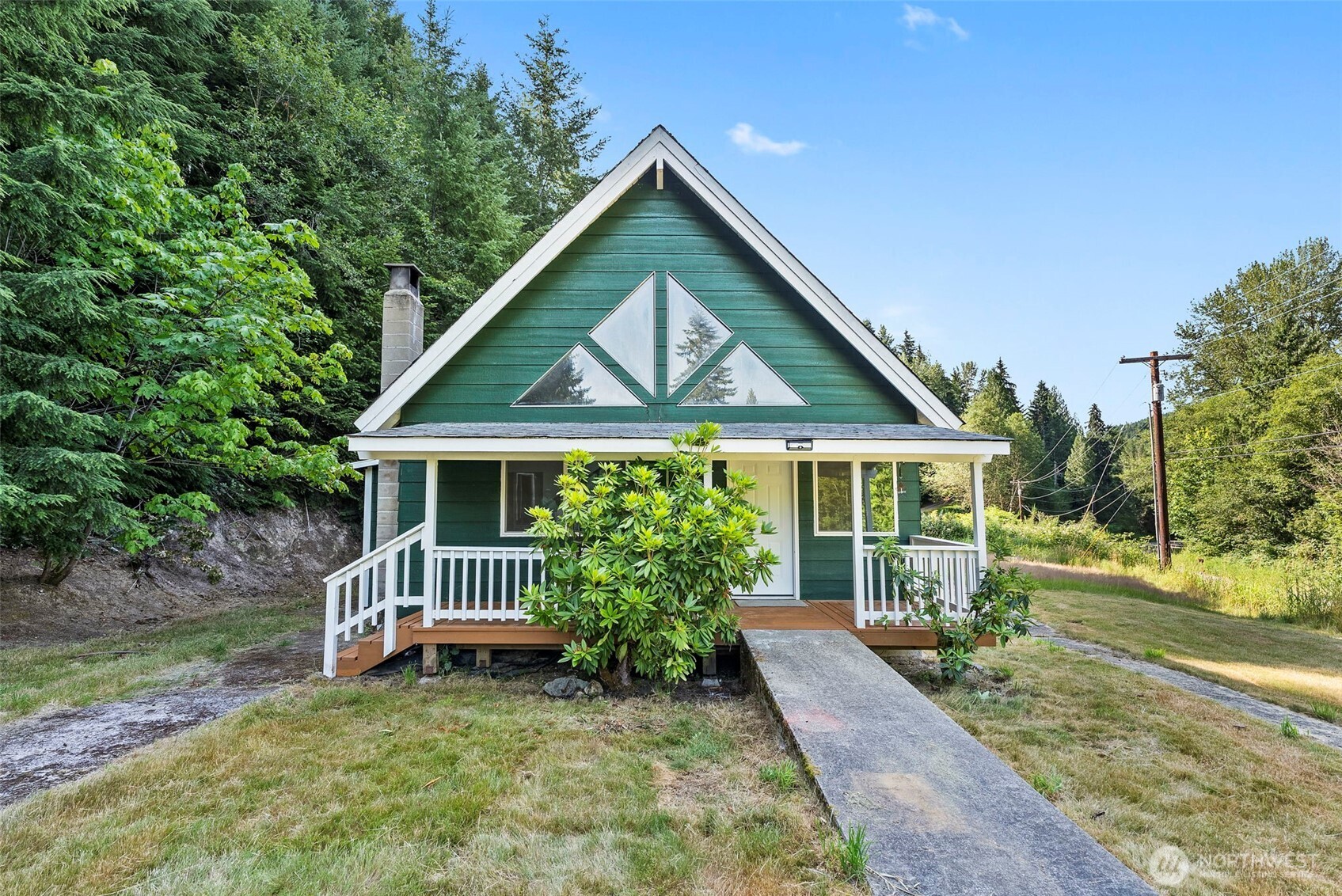 Welcome home to this charming A-frame retreat nestled on a peaceful ¾-acre lot just outside Morton. Surrounded by mature trees and offering a quiet, private setting, this cozy 2-bedroom, 1-bath home is full of warmth and character—perfect for first-time buyers, weekend getaways, or anyone looking to enjoy a simpler pace of life. The inviting A-frame design creates a cozy atmosphere with abundant natural light. Relax on the covered front porch with your morning coffee while taking in the tranquil surroundings. The spacious yard provides plenty of room for gardening, pets, or outdoor entertaining. The separate well house/shop offers valuable storage, hobby space, or a convenient workshop. Enjoy the serenity of country living while still being just minutes from Morton amenities, outdoor recreation, fishing, hiking, and nearby lakes. Whether you're looking for an affordable first home, a peaceful escape from the city, or an investment opportunity, this property offers privacy, potential, and the charm of Pacific Northwest living. Don't miss your chance to own this inviting retreat in a beautiful natural setting!