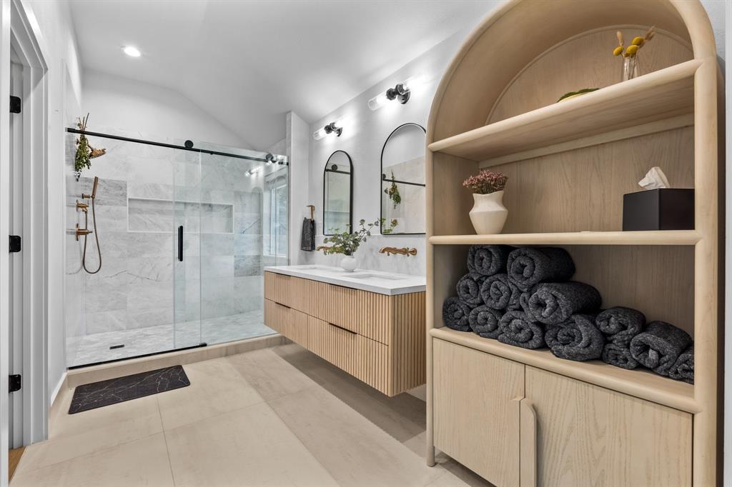 Nestled in a peaceful, tree-lined neighborhood near a golf course with easy highway access, this single-story home offers 3,085 sq ft of thoughtfully updated living space. Step inside to a welcoming layout with a living room to the left, formal dining to the right, and a versatile bonus room, with built-in shelving, ideal as a reading nook or kids’ zone. Further in, the main living area connects to the kitchen, creating the perfect setting for both everyday living and entertaining. The private primary suite offers a calming escape, complete with a redesigned bathroom featuring sleek finishes and a spacious walk-in shower. The home also includes a dedicated office, perfect for working from home, creative projects, or quiet study. New flooring throughout the common areas and numerous updates add both style and practicality to the home. Step outside and you’ll find your very own backyard oasis. A sparkling pool invites you to relax and cool off on warm Texas days, while lush landscaping and an enclosed rolling-gated yard provide privacy and safety.  It’s an outdoor space where weekends feel like vacations whether you’re lounging by the water, gardening, or hosting family barbecues. From its welcoming entry to its relaxing backyard, this home offers the perfect balance of comfort, function, and lifestyle.