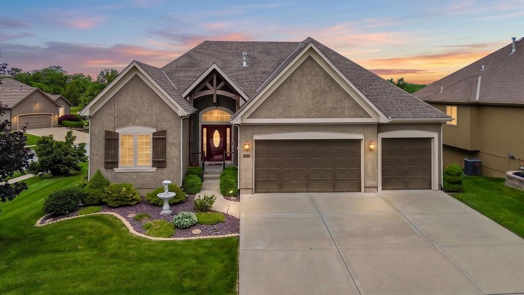 Beautiful Reverse 1.5-Story walkout situated on a large corner lot in Creekmoor community! This well-designed floor plan features a spacious open kitchen with granite countertops, a large pantry, and an oversized island that flows seamlessly into the great room—perfect for everyday living and entertaining. The generous primary suite offers a private retreat and is conveniently connected to the laundry room. Enjoy outdoor living on the covered deck overlooking the backyard.  The finished walkout lower level is designed for entertaining with a wet bar, large recreation area, and plenty of space for  guests. Additional features include a 3-car garage and abundant storage.   Experience the resort-style lifestyle that Creekmoor is known for, including access to the lake for boating and fishing, championship golf, a beautiful clubhouse, dining options, walking trails, pickleball and tennis courts, and golf cart-friendly streets throughout the community.