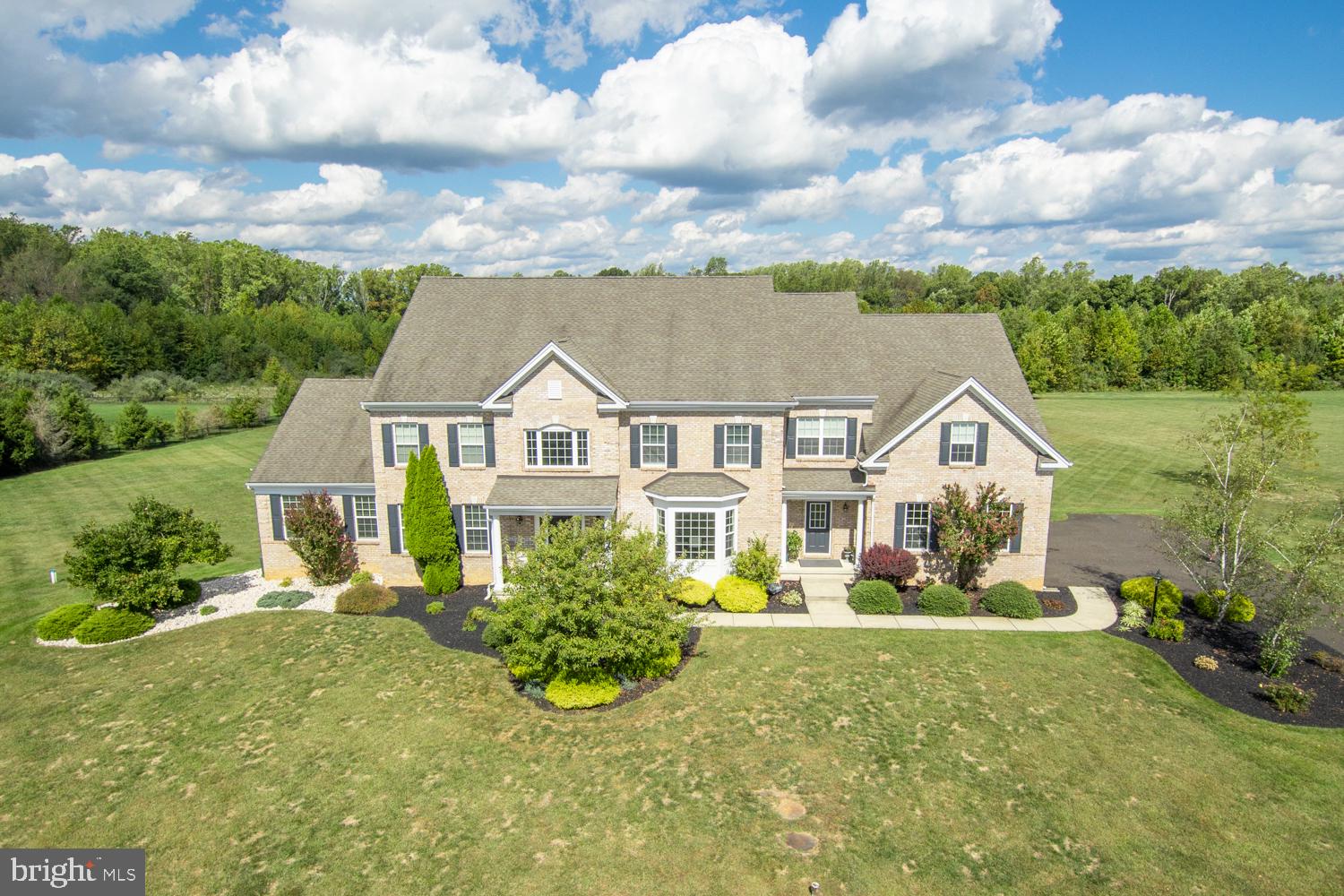 Welcome home to this impressive Colonial in desirable Weathersfield Estates, offering nearly 6,000 square feet of beautifully designed living space on more than 6.5 acres, including approximately 1.5 acres of conservation land. Surrounded by space and privacy, this exceptional property offers a peaceful retreat while providing a wonderfully flexible floor plan ideal for today’s lifestyle and multigenerational living. A dramatic two-story foyer with a sweeping staircase creates a memorable first impression, flanked by gracious formal living and dining rooms. The heart of the home is the expansive, updated kitchen, thoughtfully designed for both everyday living and entertaining with new appliances, abundant cabinetry and counter space, a large center island, breakfast bar, spacious dining area, and butler’s pantry. The kitchen opens effortlessly to the impressive family room, overlooked by the second-floor balcony. A private home office tucked behind French doors provides the perfect work-from-home space. A true highlight of the main level is the private in-law suite featuring a full bath and walk-in closet, ideal for extended family, guests, or an au pair. A powder room, laundry room, and convenient access to the three-car garage complete the first floor. Upstairs, the spacious primary suite is a retreat of its own, featuring a separate sitting area, oversized walk-in closet, and private en-suite bath. Four additional generously sized bedrooms and two additional full baths provide plenty of room for family and guests. The full basement offers even more living and entertaining space, with a finished area featuring a wet bar and island as well as a full bath, while the unfinished portion provides abundant storage and space for mechanicals. With its impressive scale, flexible six-bedroom layout, extensive living space, beautiful setting, and numerous updates, this Weathersfield Estates home offers a rare combination of privacy, functionality, and room to grow. A truly special property that needs to be experienced in person.