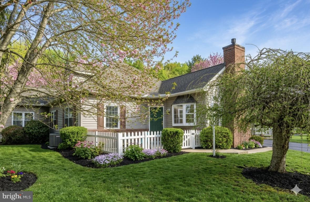 701 Homestead Lane offers the perfect blend of luxury and low-maintenance living within the highly desirable Concord Crossing community. This is not a 55+ neighborhood, but it features a versatile layout that appeals to every stage of life, all situated within the award-winning Garnet Valley School District. A charming white picket fence and paver patio welcome you, and upon entering the home you are greeted by the main living space, which is an open floor plan bathed in natural light, highlighted by gleaming, newly refinished hardwood floors and a cozy gas fireplace. The kitchen is designed for everyday living, featuring a breakfast bar, abundant counter space, a brand-new stove, and has an adjacent first-floor laundry room with interior access to the one-car garage for ultimate convenience.The main level is designed for ultimate flexibility, boasting a primary suite complete with a walk-in shower, double sinks, and a generous walk-in closet. An additional main-floor room offers the perfect footprint for a home office or a third bedroom, a common conversion in this community that simply requires the addition of a door. Upstairs, a second private suite features brand-new carpeting, a full bath, and dual walk-in closets. The lower level adds even more value with a finished living area alongside a large unfinished storage space. Positioned just minutes from the Delaware border for tax-free shopping, major commuter routes, and PHL International Airport, this move-in-ready home offers an unparalleled lifestyle near world-class golf, dining, and natural areas.