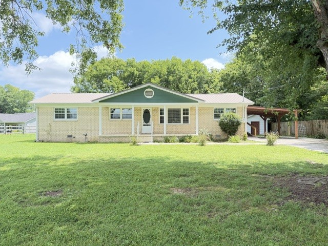 Escape to the peace and quiet of country living with this beautifully renovated home that's full of charm and modern updates! From the durable metal roof and energy-efficient new windows to the elegant crown molding throughout, every detail has been thoughtfully enhanced. Step inside to find a warm and inviting interior featuring updated bathrooms, a spacious updated kitchen with stainless steel appliances, and comfortable living space ready for you to make your own.  Outside you will appreciate the added convenience of two storage buildings, providing plenty of room for tools, hobbies, or extra storage. This country gem offers the perfect blend of comfort, style, and functionality.