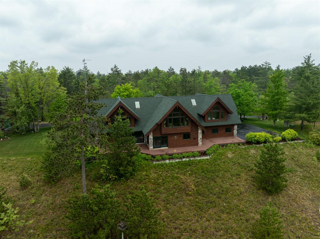 Stunning 4,200 sq. ft. Log-Sided Home with Breathtaking Views on 40 Acres!
Discover this exceptional 4,200 sq. ft. log-sided home perched atop a hill overlooking the scenic Brush Creek Valley. Built as the builder's personal home and meticulously maintained by the original owner, no expense has been spared in its upkeep and recent renovations. This 5-bedroom, 3.5-bath home features soaring cathedral ceilings and a thoughtful design that blends comfort with rustic elegance.
Completely updated within the last two years, the home offers new LVP flooring, a new roof, fresh paint, driveway sealant, stained and blasted exterior logs, updated fixtures, blinds, a new furnace, AC unit, and garage doors.
Situated on a quiet, remote setting just outside the town of Hillman, this property offers incredible privacy and stunning Montana-like views. The long, winding driveway leads to two large outbuildings , 60x40 pole barn and a 36x30 detached workshop/garage, both with concrete floors.
Outdoor enthusiasts will appreciate direct snowmobile trail access and the property's adjacency to over 100,000 acres of state land perfect for hunting, walking trails, and food plots. This is a rare opportunity to own a piece of paradise with unmatched views and endless recreation.