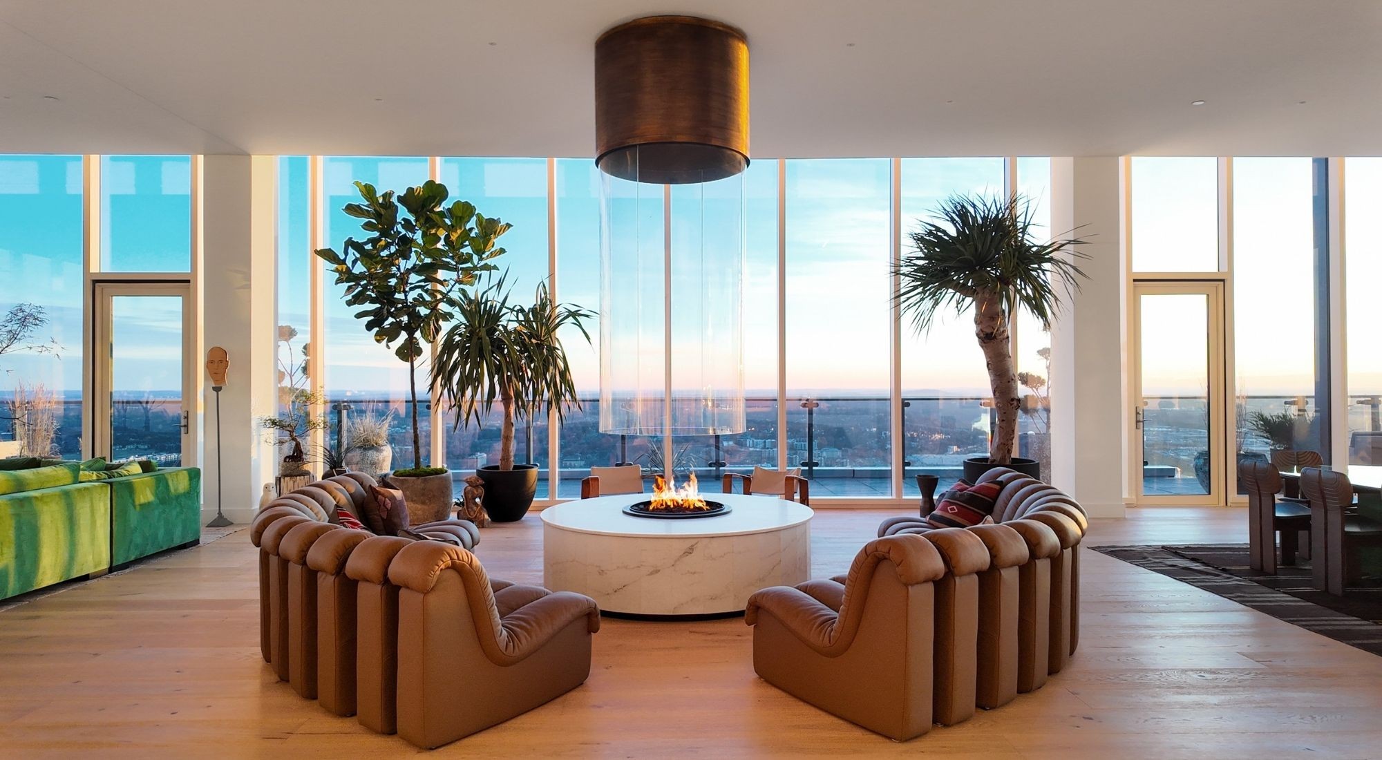 Forty stories above downtown Nashville, this ultra-luxury Penthouse at the Four Seasons ranks among the most exceptional residences ever offered in the city. Spanning just under 5,000 sf, with a deep outdoor deck running the full length of the penthouse, this home blends custom craftsmanship with the full benefits of world-class Four Seasons service in an unmatched location. Every inch of this penthouse has been meticulously curated, engineered, and executed at a level that surpasses anything else in the city. At the center of the home, a handcrafted 16-foot curved Calacatta marble island resembles a single, seamless floating sculpture. Hidden drawers, integrated cabinetry, sleek high-gloss finishes, and fully concealed appliances preserve a minimalist, gallery-style look. A secondary service kitchen, entirely clad in stainless steel, supports both everyday living and large-scale entertaining. Anchoring the main living area is a custom gas fireplace crafted in France by Bloch Designs - a true statement piece in copper, curved glass, brass, and marble with sculptural presence and refined artistry. The Gathering Room transforms into a private theater featuring a 120-inch floating screen with laser projector, concealed within a motorized mirror-drop mechanism, creating a cinematic environment that rivals professional screening rooms without compromising aesthetics when not in use. The primary bedroom suite is a sanctuary unto itself, featuring dual closets, an Antonio Lupi bathtub, and Fantini Rubinetti fixtures. Secondary bathrooms also feature exquisite Italian marble with Waterworks selections. This fully automated smart home features Control4 Automation and Josh.ai voice control, enabling effortless management of lighting, audio, video, and climate. With five-star Four Seasons service, residents-only amenities, and a 40th-floor vantage point, this Penthouse is a one-of-one offering—the pinnacle of urban luxury in Nashville and a lifestyle reserved for a select few.