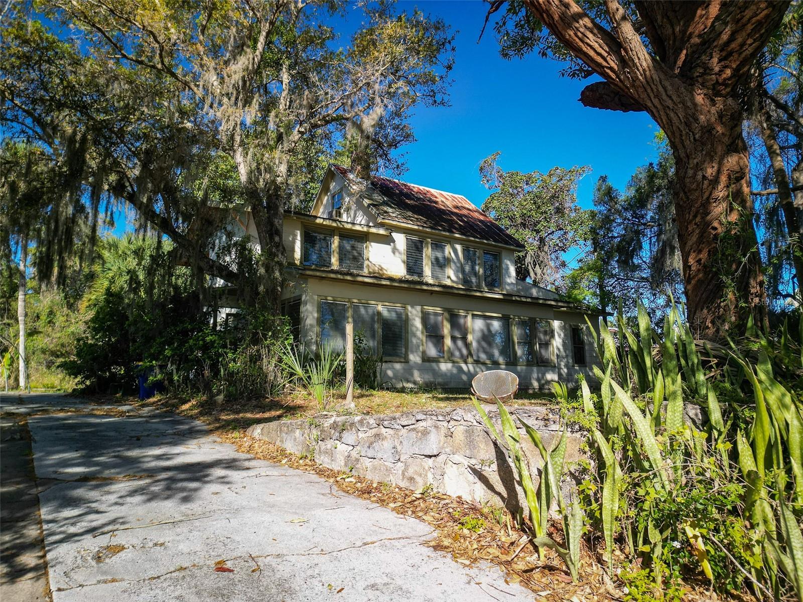 Old home in need of a total rehabilitation in great location across from boat ramp and just a short golf cart ride to Canal Street. The buildings are most likely a tear down but possibly a project for a skilled remodeler or contractor with vision and resources. Priced at land value.  Demolition estimate available.  City services (gas, electric, water) connected.  Deep, wide and nicely elevated 134 x 260 parcel with mature trees and views of the Intracoastal Waterway and the Edgewater boat ramp. Need space to garage your car collection, or have a workshop at your backdoor with plenty of room for your boat and trailer, too, this property has much to offer.
