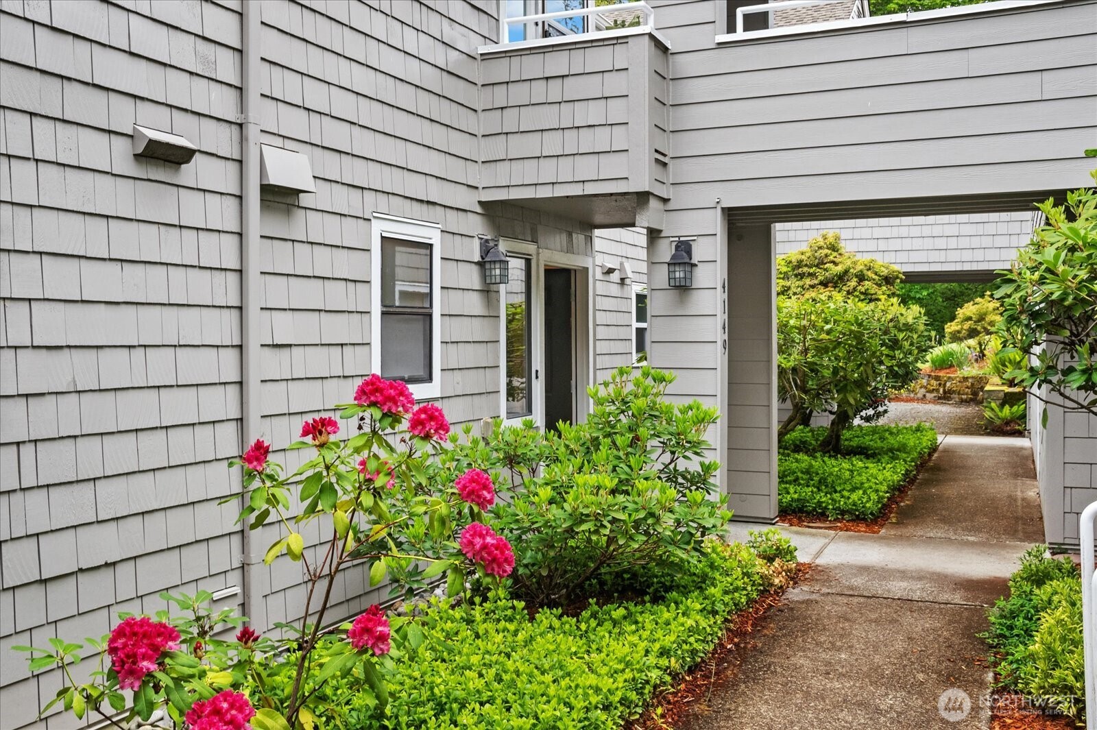 Welcome to this cozy, private SW facing ground floor condo in Center Village overlooking community lawn & green space with fenced rear patio, yard and covered BBQ area.  Updated kitchen with quartz counters opens to dining/living rooms.  Spacious full bath features American Standard walk-in tub, raised quartz counters and additional storage.  Large primary bedroom with 2 closets.  Newer carpet & HWT, fresh paint. Convenient storage room and oversized 1 car garage with rear entry door and workbench space.  Lots of guest parking for entertaining.  Independent lifestyle with all the amenities of Providence Point 55+ gated community including indoor pool, gym, tennis/pickleball, community garden, trails, clubs, activities.