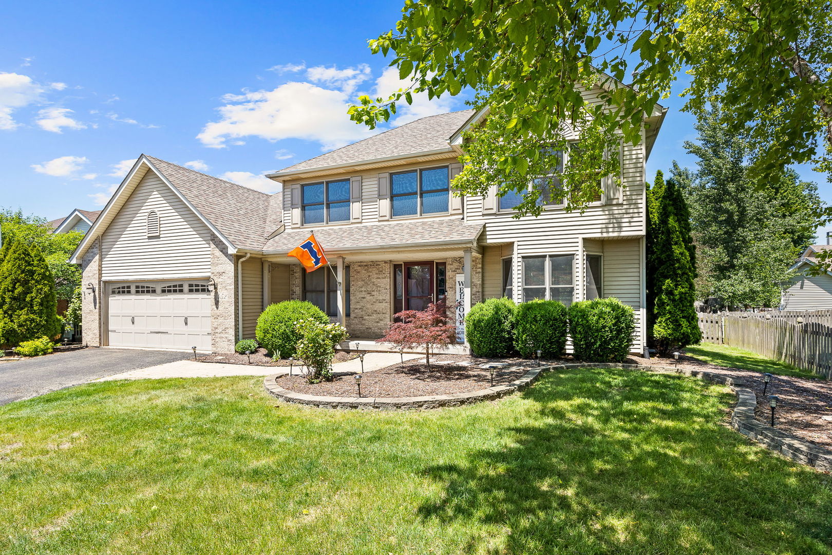 Welcome home to this beautifully maintained residence in the highly sought-after Deerpath Creek subdivision of Oswego! From the moment you arrive, the inviting curb appeal and welcoming front porch set the tone for what's inside. Offering a spacious and functional floor plan, this home features 5 bedrooms, 2.5 baths, and flexible living spaces designed for today's lifestyle. The vaulted primary suite serves as a relaxing retreat with a soaking tub, separate shower, dual quartz vanities, and a walk-in closet complete with custom organizers.  The updated eat-in kitchen blends timeless style and functionality with abundant cabinetry, granite countertops, stainless steel appliances, and a center island with seating. Formal living and dining rooms provide great entertaining space, while the cozy family room with a brick fireplace creates the perfect spot to unwind. A main-level den offers versatility for a home office, playroom or study area.  The finished basement expands the living space with a large recreation area, a fifth bedroom ideal for guests or related living, and generous storage rooms. Additional highlights include a 2-car garage, attic storage with ladder access, and a fully fenced backyard featuring a deck and patio ready for outdoor gatherings. Conveniently located near parks, trails, shopping, and dining.