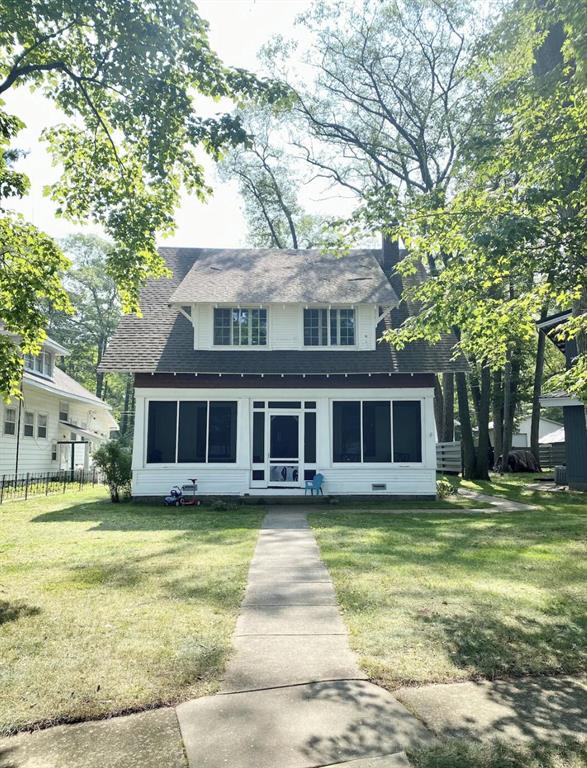 Nestled on the shores of Lake Margrethe, this fully furnished, cozy and historic 4-bed, 1.5-bath Cape Cod offers sweeping views and timeless charm. Built in 1937, it features a cedar shake exterior, dormer windows, and a warm craftsman-inspired interior with refinished hardwood floors, wood-beamed ceilings, and a brick fireplace. Recent updates include a new upstairs bath, kitchen range, plumbing, whole-house water filtration, and new windows in three bedrooms. The detached two-car garage has upgraded electric. Enjoy 50 feet of private frontage, a peaceful screened porch, and a lakeside gazebo perfect for entertaining. With a newer water heater and thoughtful upgrades throughout, this Lake Margrethe gem blends classic character with modern comfort.