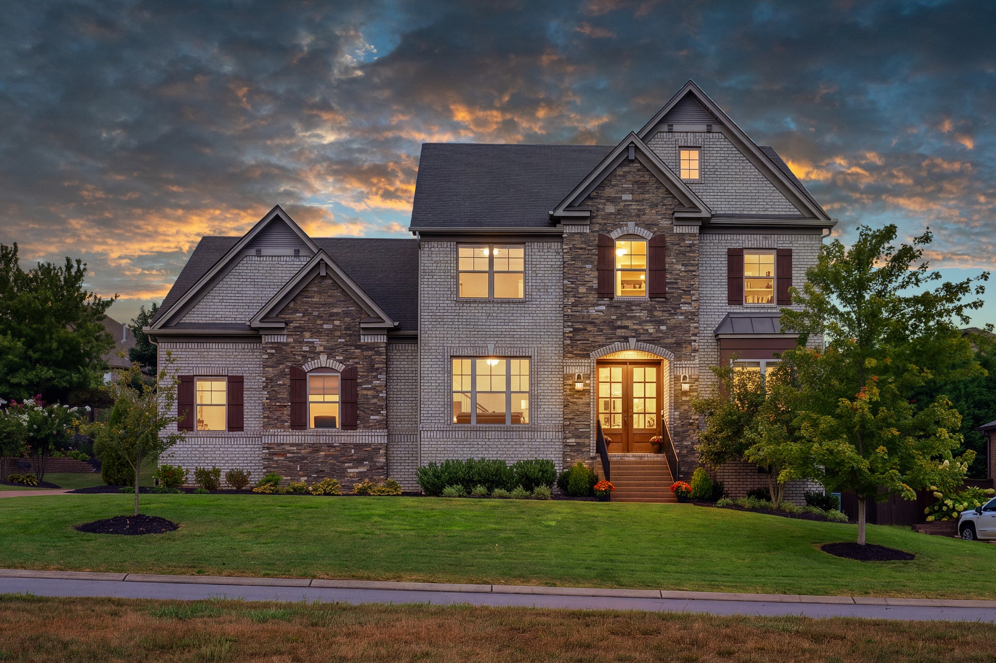 Beautifully well maintained Home in Arrington Retreat! Lovely double glass doors pour light into a large foyer with tall ceilings, upgraded lighting and a view all the way through the spacious open concept first floor. Wood detail and French doors open onto formal dining room with coffered ceilings, currently featured as an office to the left. To the right is a bedroom, full bathroom and coat closet. Bull nose rounded doorways add a level of sophistication leading into the main living area. The living room has a beautiful stone gas fireplace, motorized shades and sits opposite a very generous kitchen featuring a huge island with all the extra storage underneath. The kitchen has a full large walk in pantry, gas range and double ovens. Off of the kitchen sits a large breakfast room and a fabulous custom family entry mudroom drop zone with lots of built in storage coming in from the 3 car garage. Just in time for the cooler weather, come sit out on the wonderful back porch & enjoy the game with privacy curtains, fireplace and outdoor tv!!  Upstairs features a landing with opportunities, two bedrooms with ensuites, a huge bonus room with surround sound and lots of walk out attic storage and  a large Primary Retreat!! The Primary suite is a spacious bedroom opening onto a private porch inviting one to come enjoy a glass of wine outside before bed! The Primary has a large bathroom with both a soaking tub and a large shower and a massive walk in closet. For convenience, the Primary closet opens onto the generous laundry room. Open Houses- Saturday 10/3 from 1-3                        Sunday 10/4 from 1-3